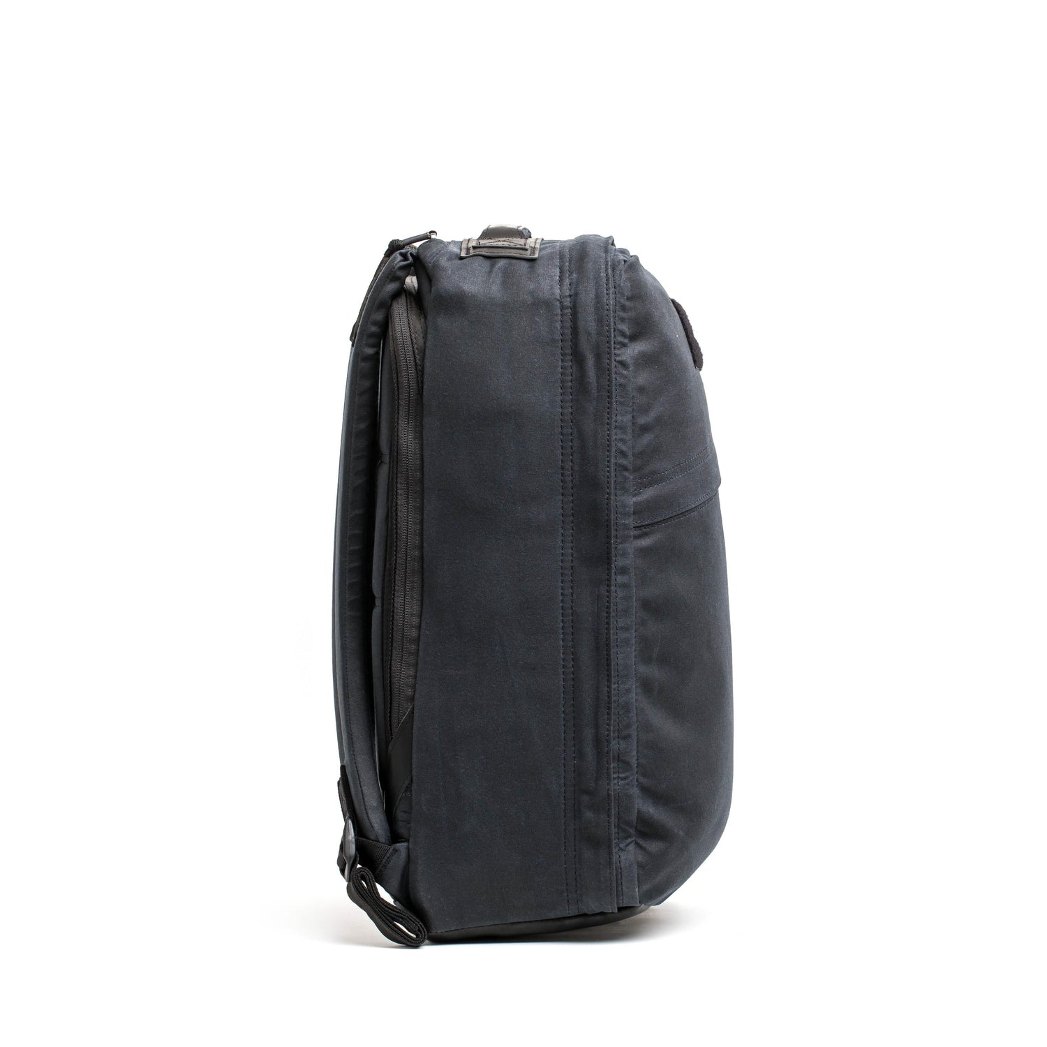 Side view of a black GORUCK Heritage Ruck durable 10.10 oz Army Duck fabric backpack