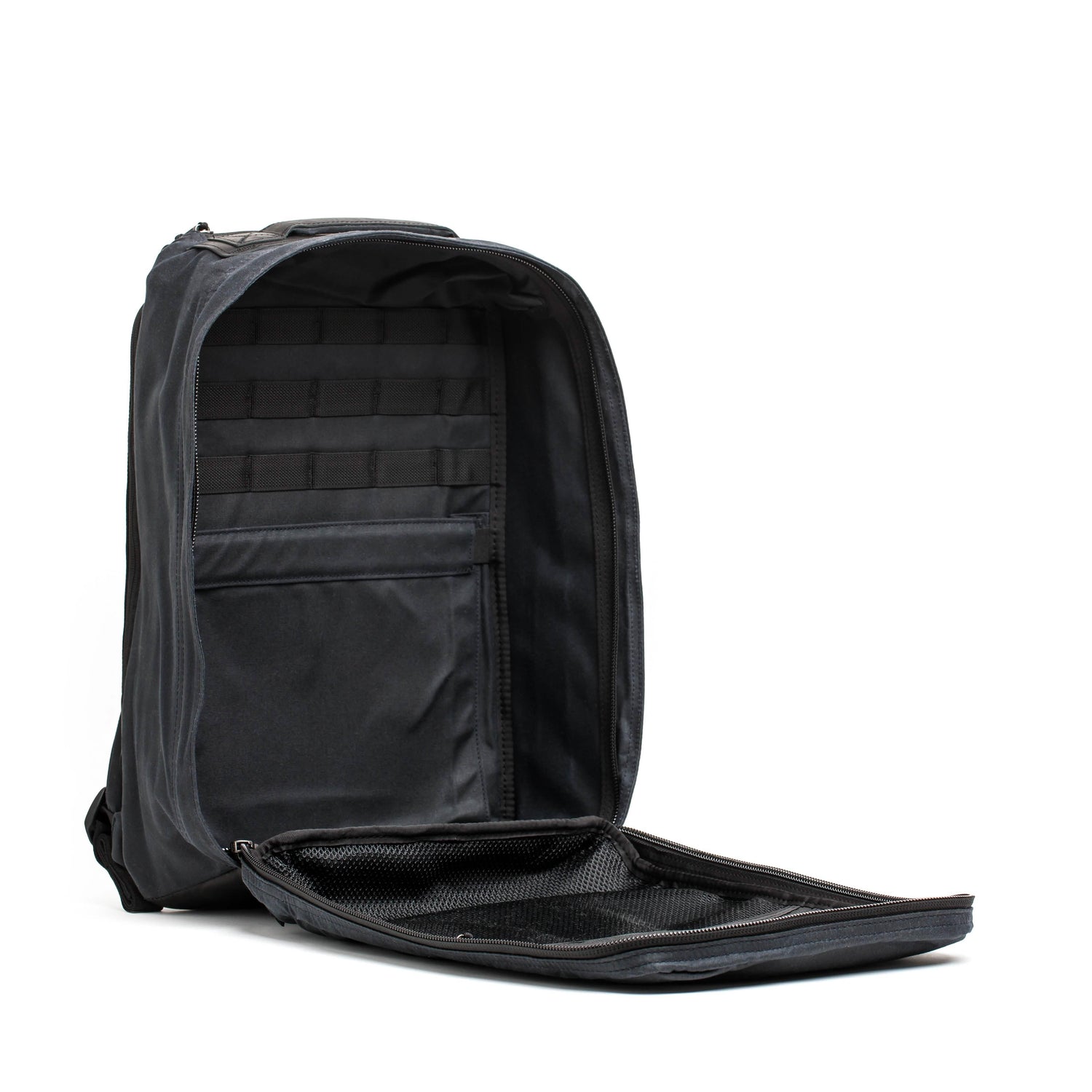 Open black GORUCK backpack with internal organization and mesh zip pocket on white background