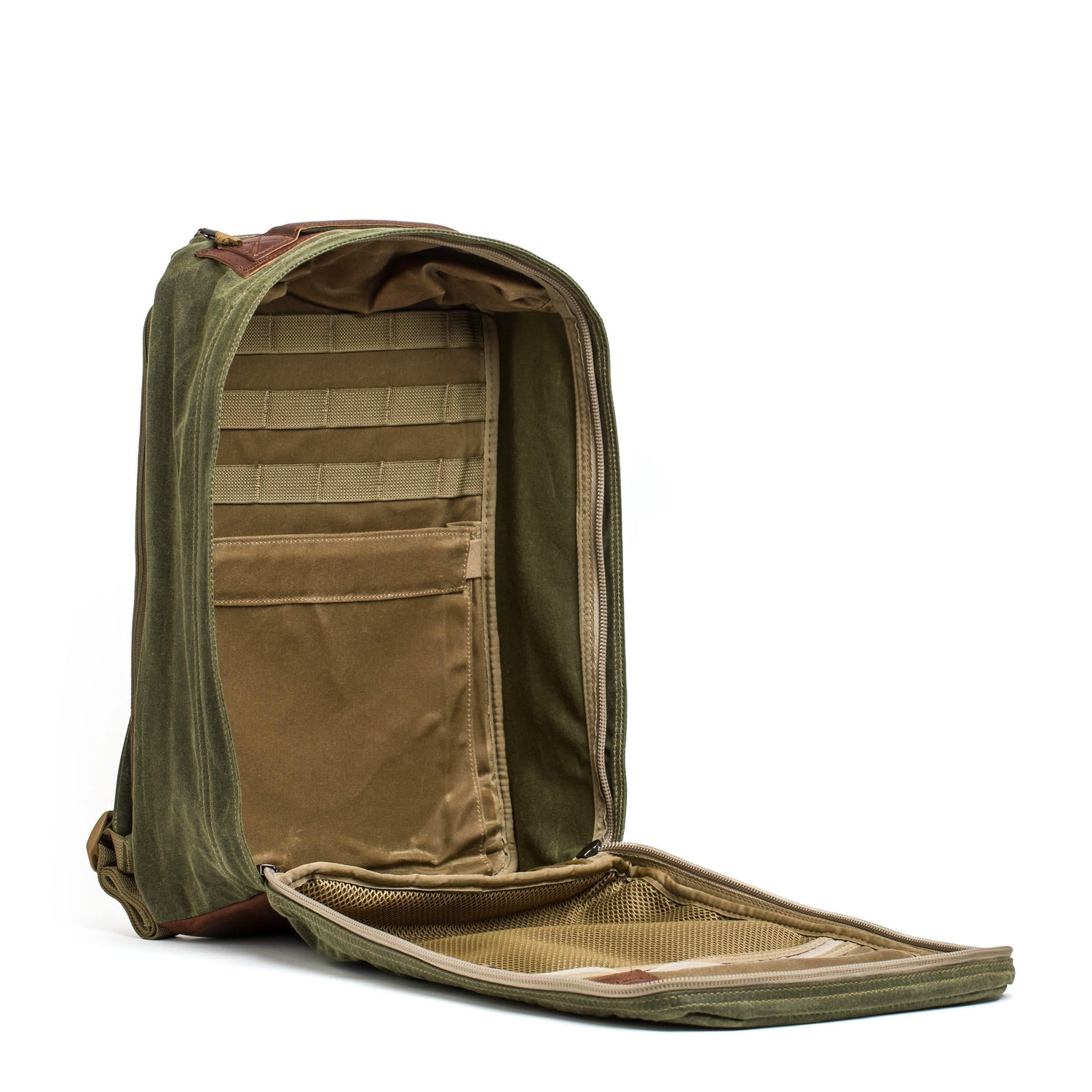 Open olive and tan rugged GORUCK backpack showing spacious interior with multiple pockets and MOLLE webbing