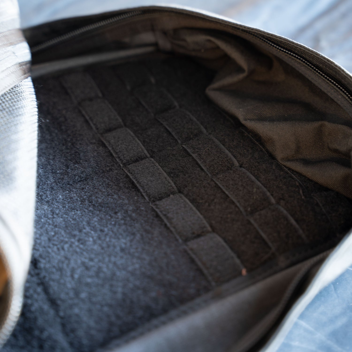 Close-up of the inside of the GR1 Shooter - Built by SCARS, featuring a zippered opening and webbing loops on the inner lining—engineered with SCARS team input.