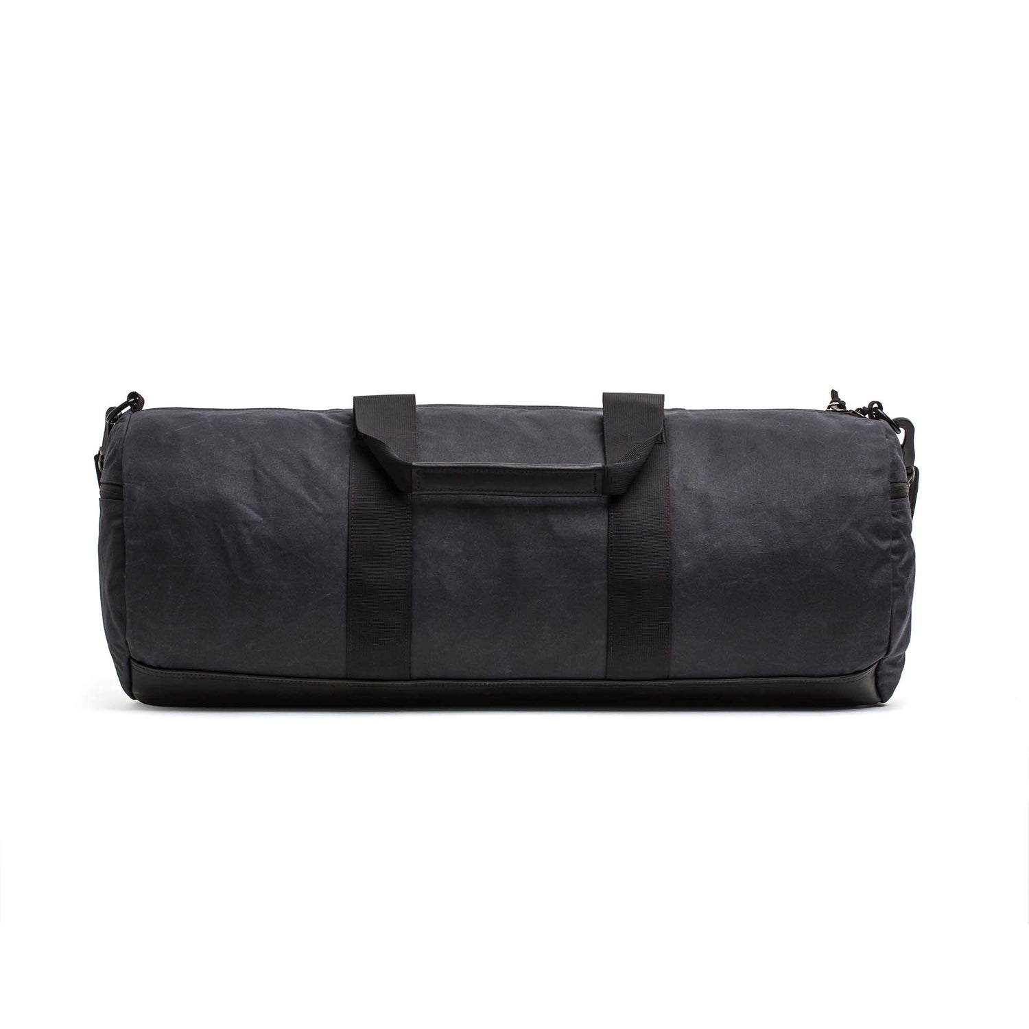 The Gym Bag - Waxed Canvas features short handles and a shoulder strap, shown against a white background.