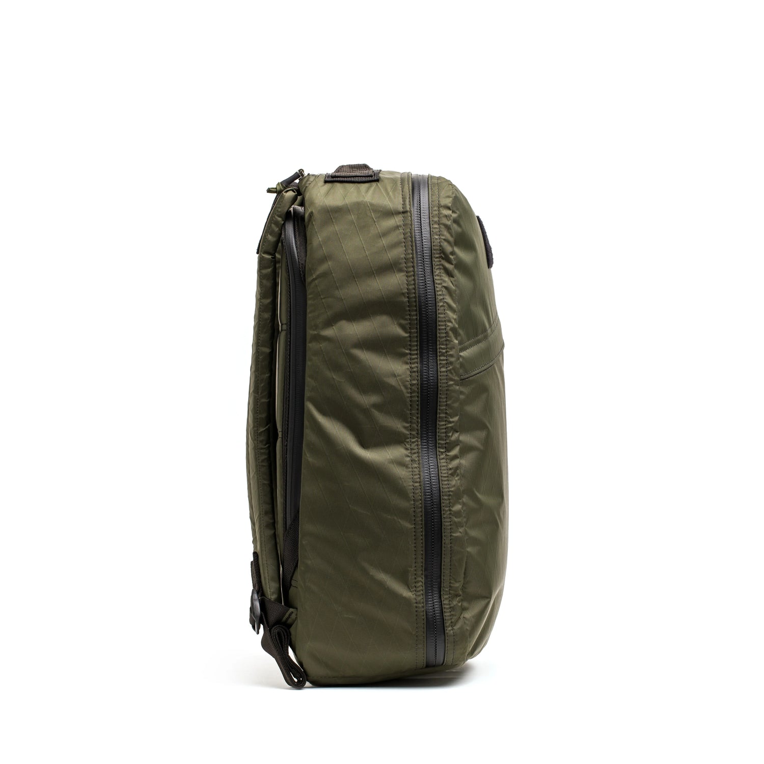 Side view of durable dark green GORUCK backpack with waterproof zippers for rucking gear