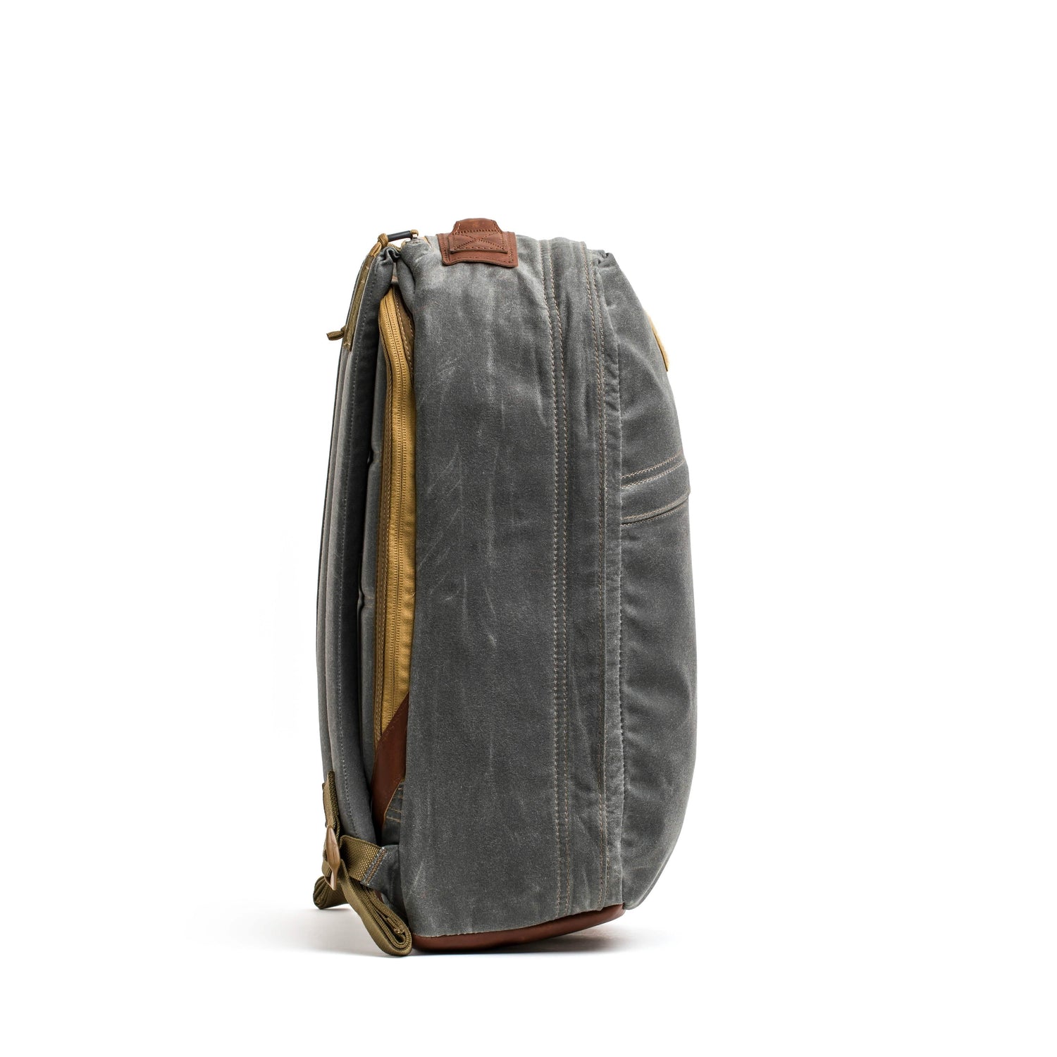 Side view of GORUCK Heritage Slate backpack with durable waxed canvas and leather accents
