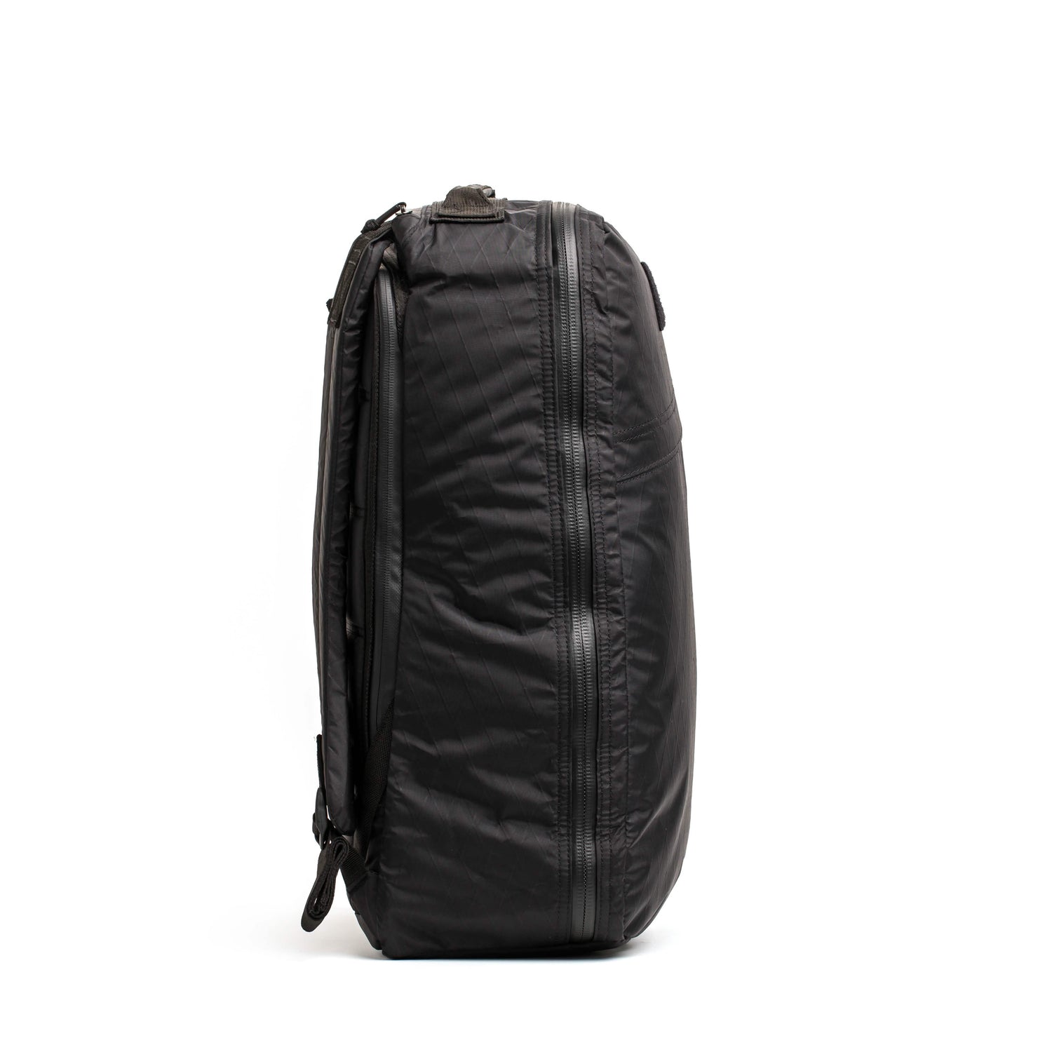 Side view of black GORUCK tactical rucksack with durable zippers and padded straps