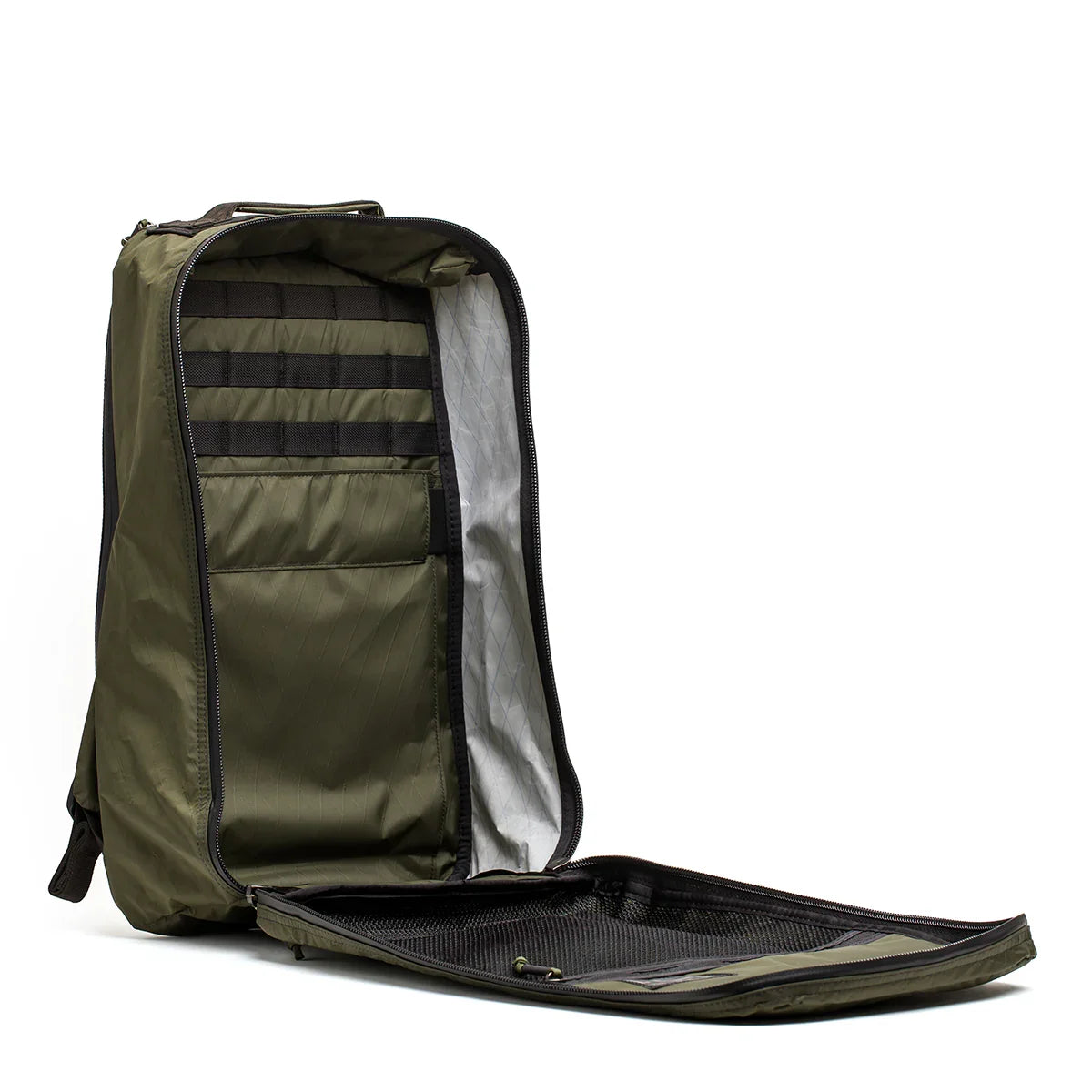 Open dark green rugged rucksack with organized interior pockets and zippered mesh compartment by GORUCK