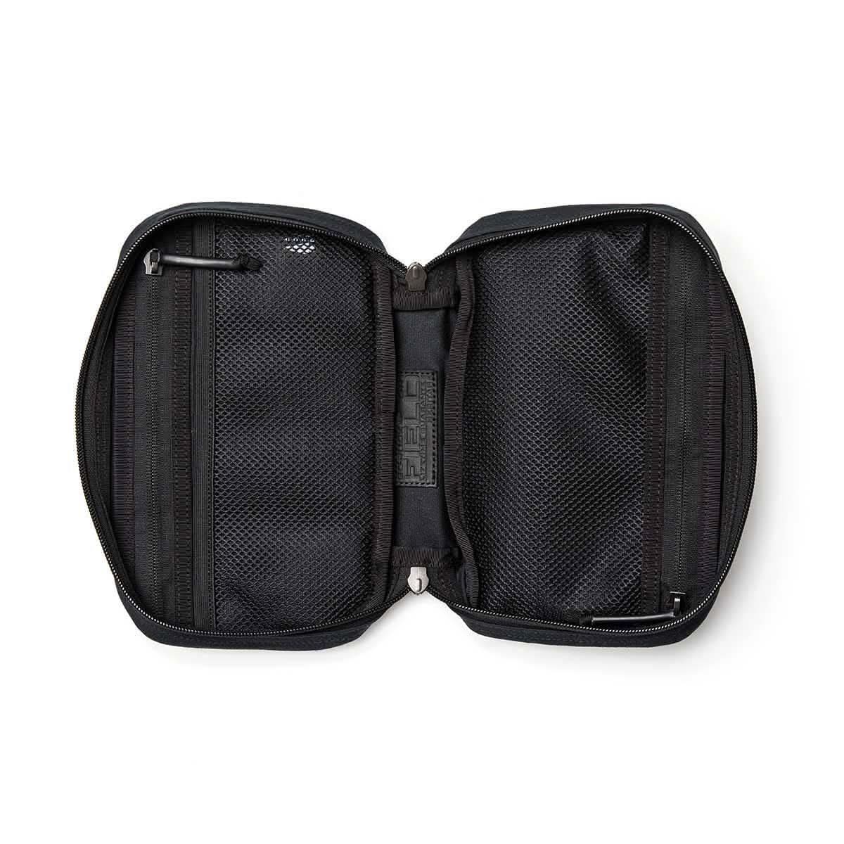 Open black GORUCK Field Pocket organizer with dual mesh zippered compartments on white background