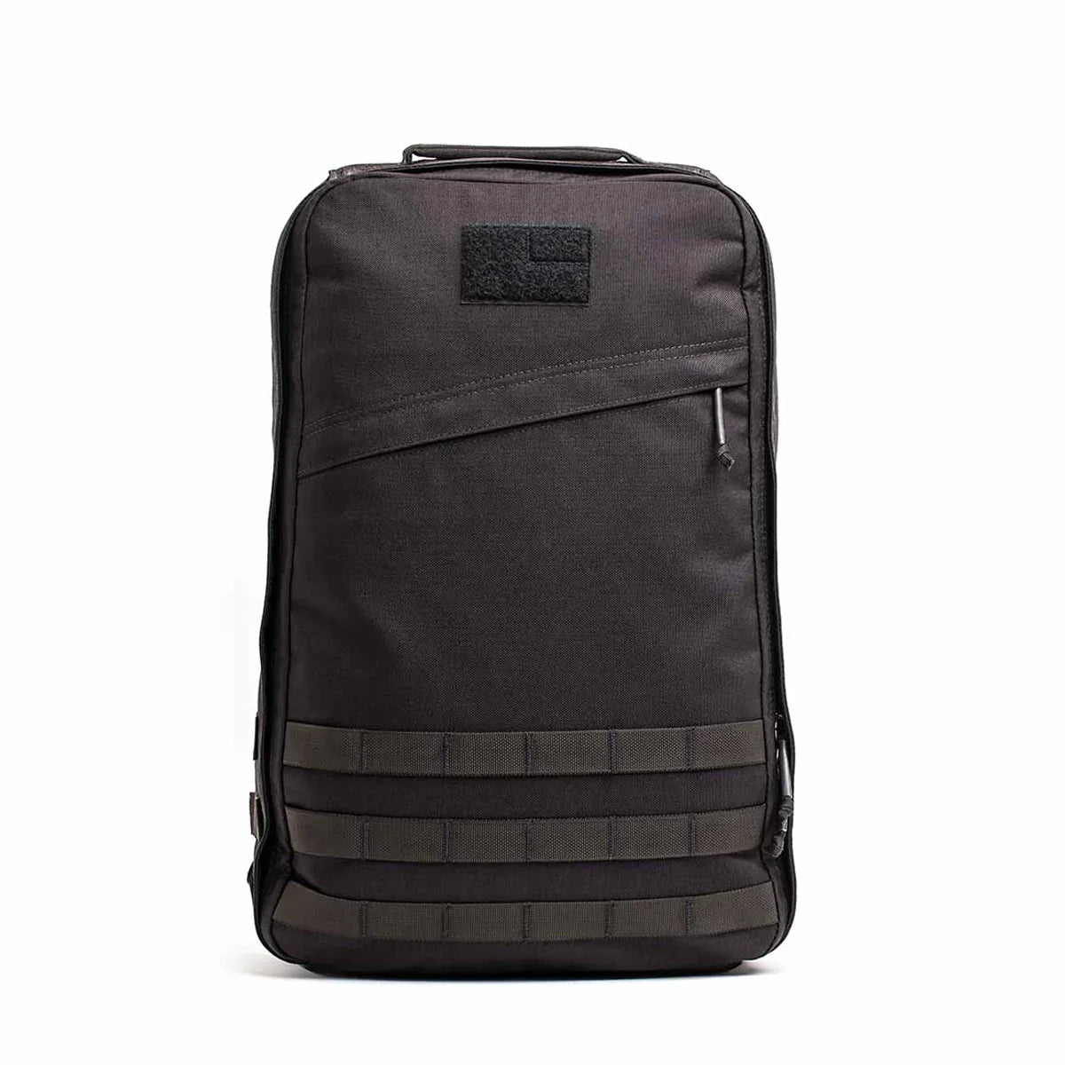 Black GORUCK tactical backpack with MOLLE webbing and diagonal zipper pocket on white background