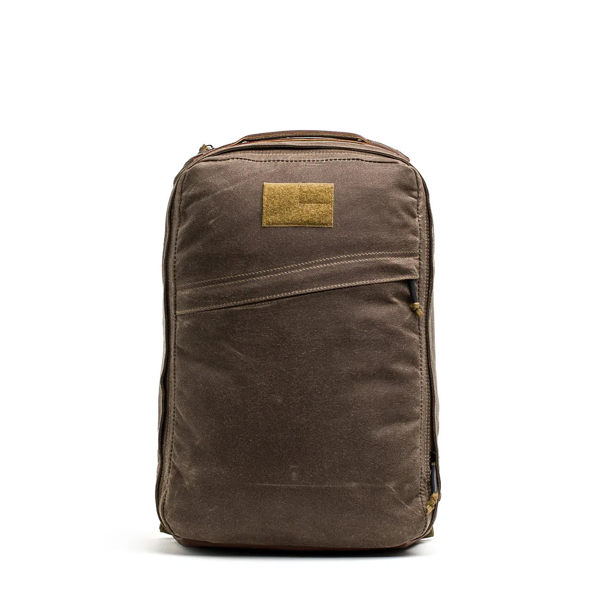 GORUCK brown tactical rucksack with waxed canvas, front zipper pocket, and patch area