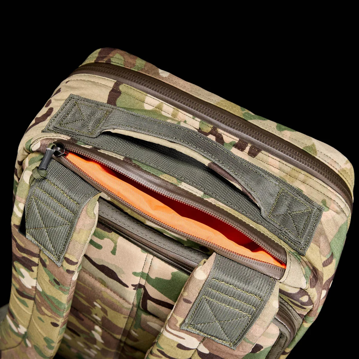 GORUCK backpack in Multicam camouflage fabric with reinforced straps and orange interior lining