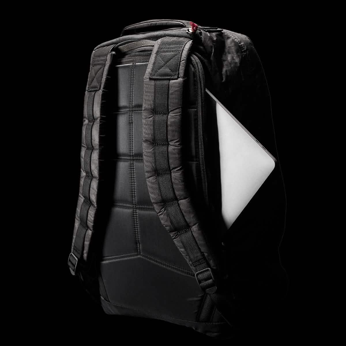 Black GORUCK GR1 Dyneema 26L backpack with padded straps and laptop pocket, shown against black background