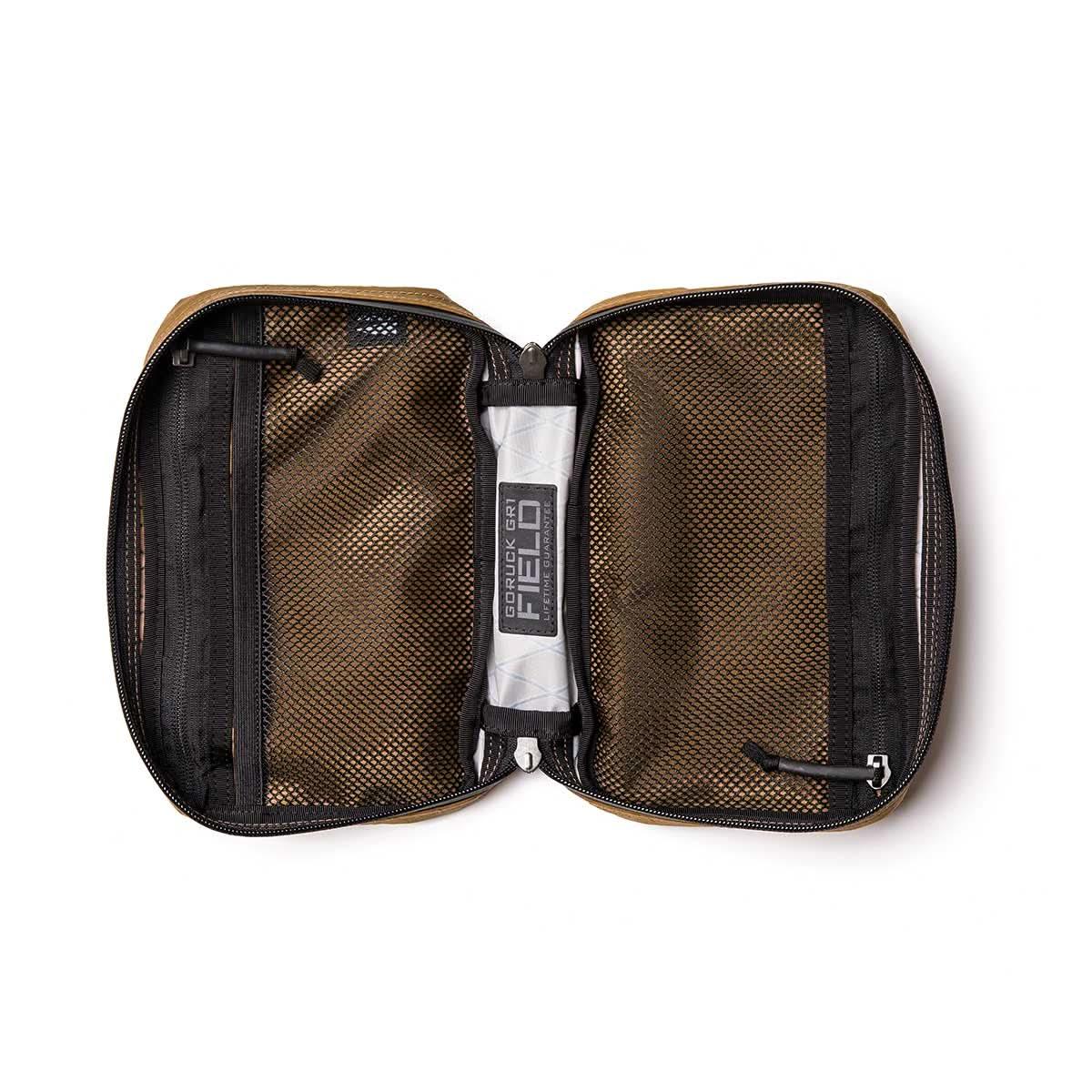 GORUCK GR1 Field Pocket XPAC Slick Coyote open, showing mesh compartments and gear inside.