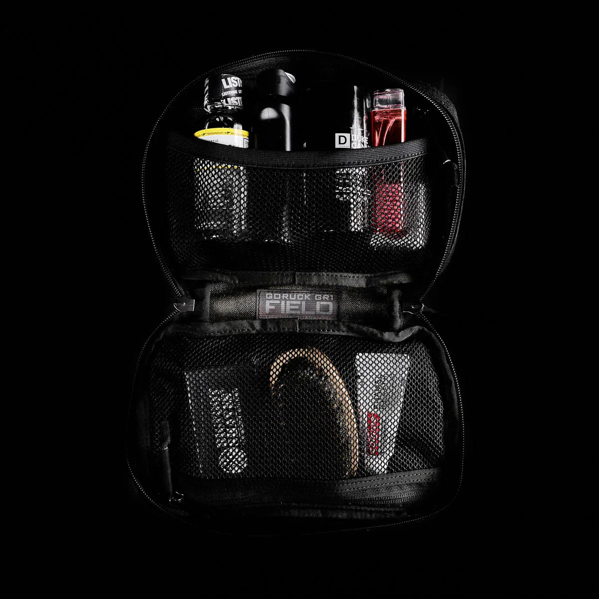 Open GORUCK GR1 Field Pocket black multicam gear organizer with mesh compartments holding toiletries and personal items