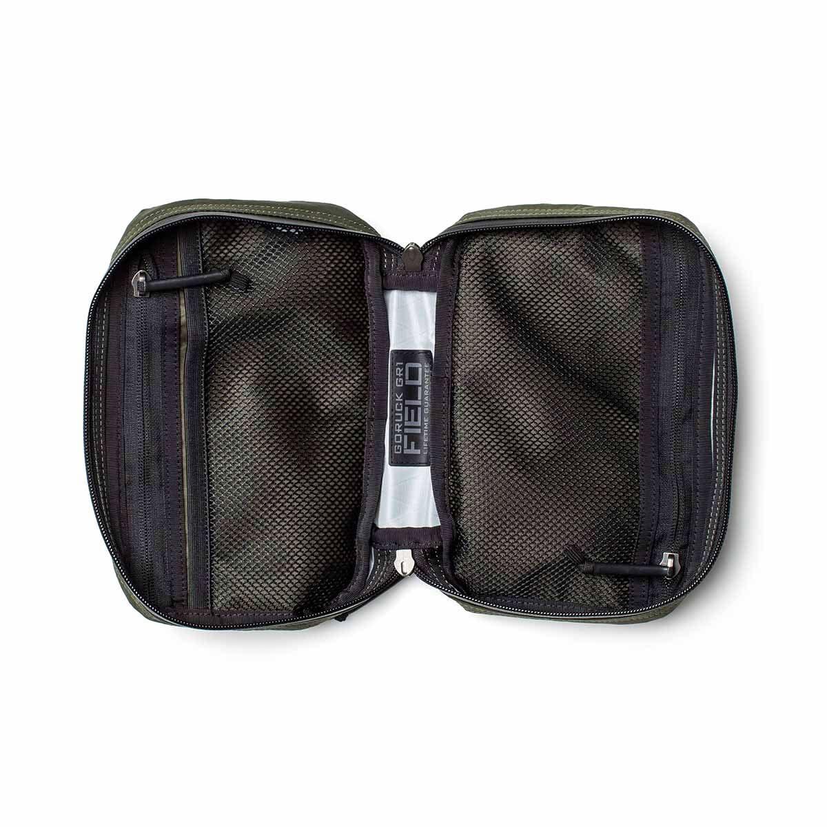 GORUCK GR1 Field Pocket XPAC Slick in dark green, open to show mesh zippered compartments
