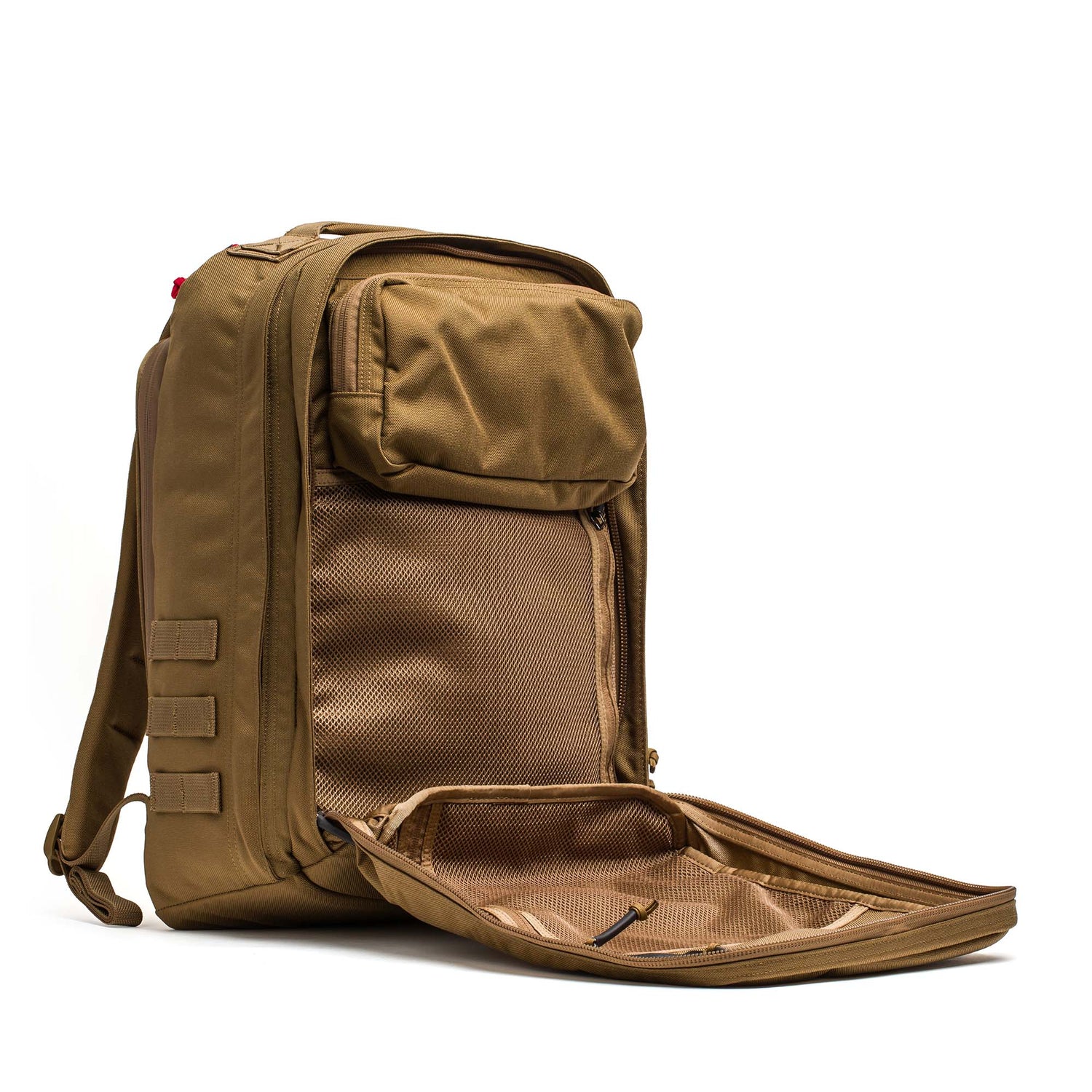 A GR2 - Cordura backpack in brown is shown on a white background with its main compartment unzipped, revealing inner mesh pockets.