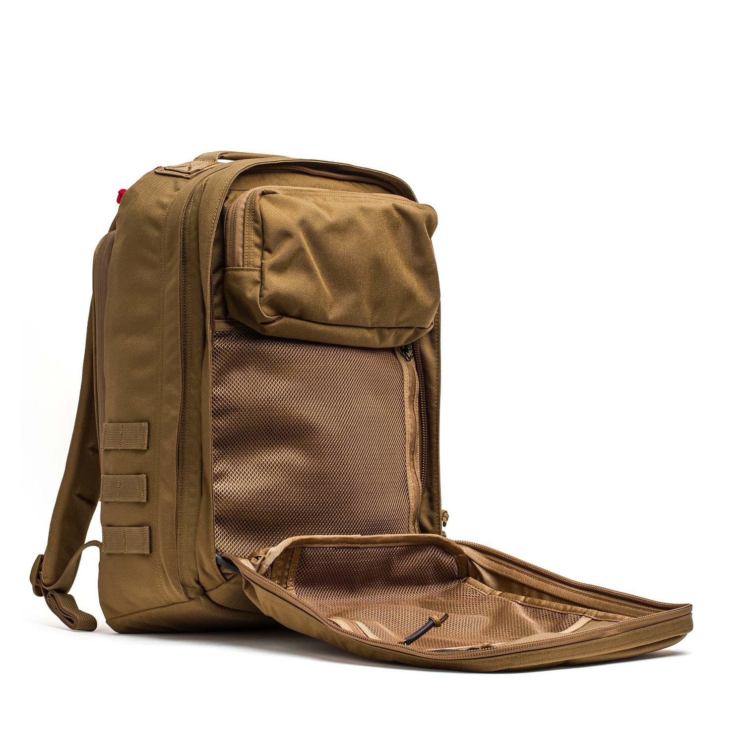A GR2 - Cordura backpack in brown is shown on a white background with its main compartment unzipped, revealing inner mesh pockets.