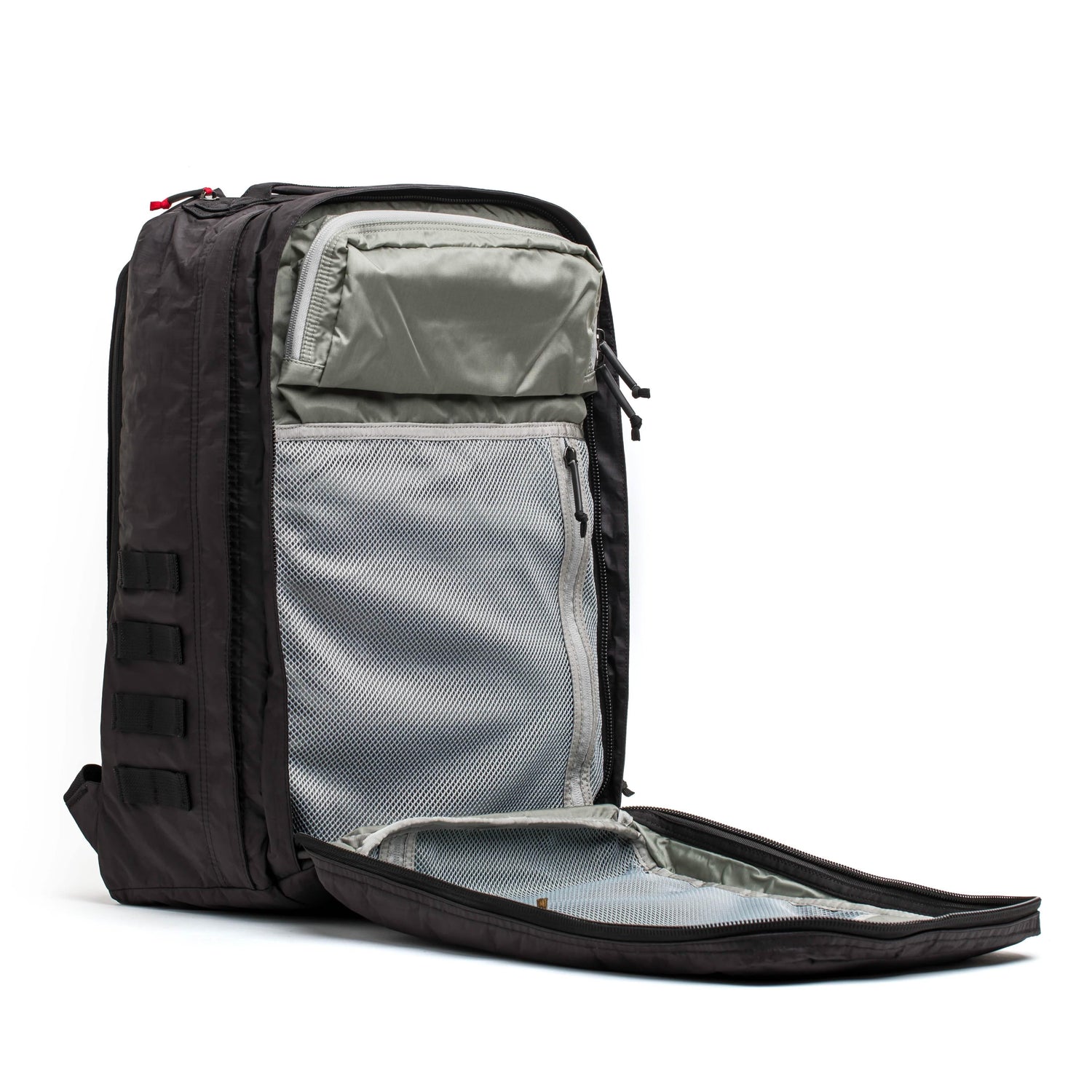 Black GORUCK backpack opened flat showing grey and mesh interior organization with top stash pocket