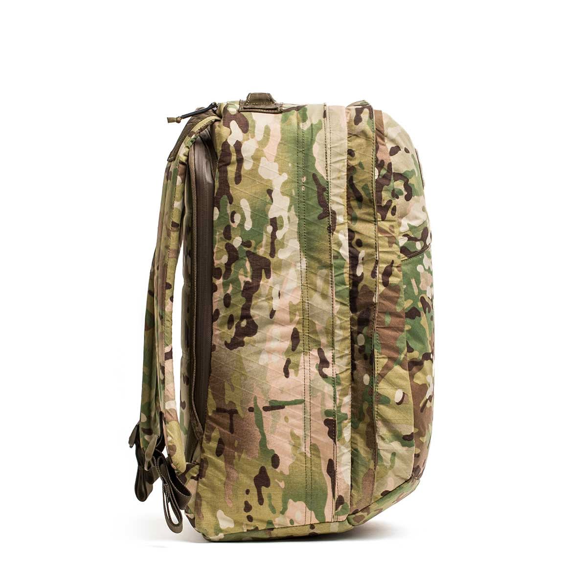 Side view of the GR2 X-PAC backpack in camouflage pattern, showcasing AquaGuard zippers and adjustable straps, standing upright.