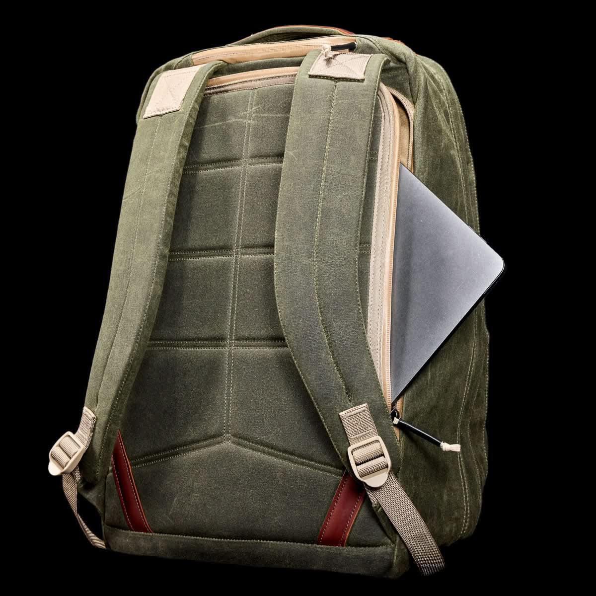 GORUCK GR2 34L olive field waxed canvas rucksack with tan accents and padded back, laptop partially visible in side pocket
