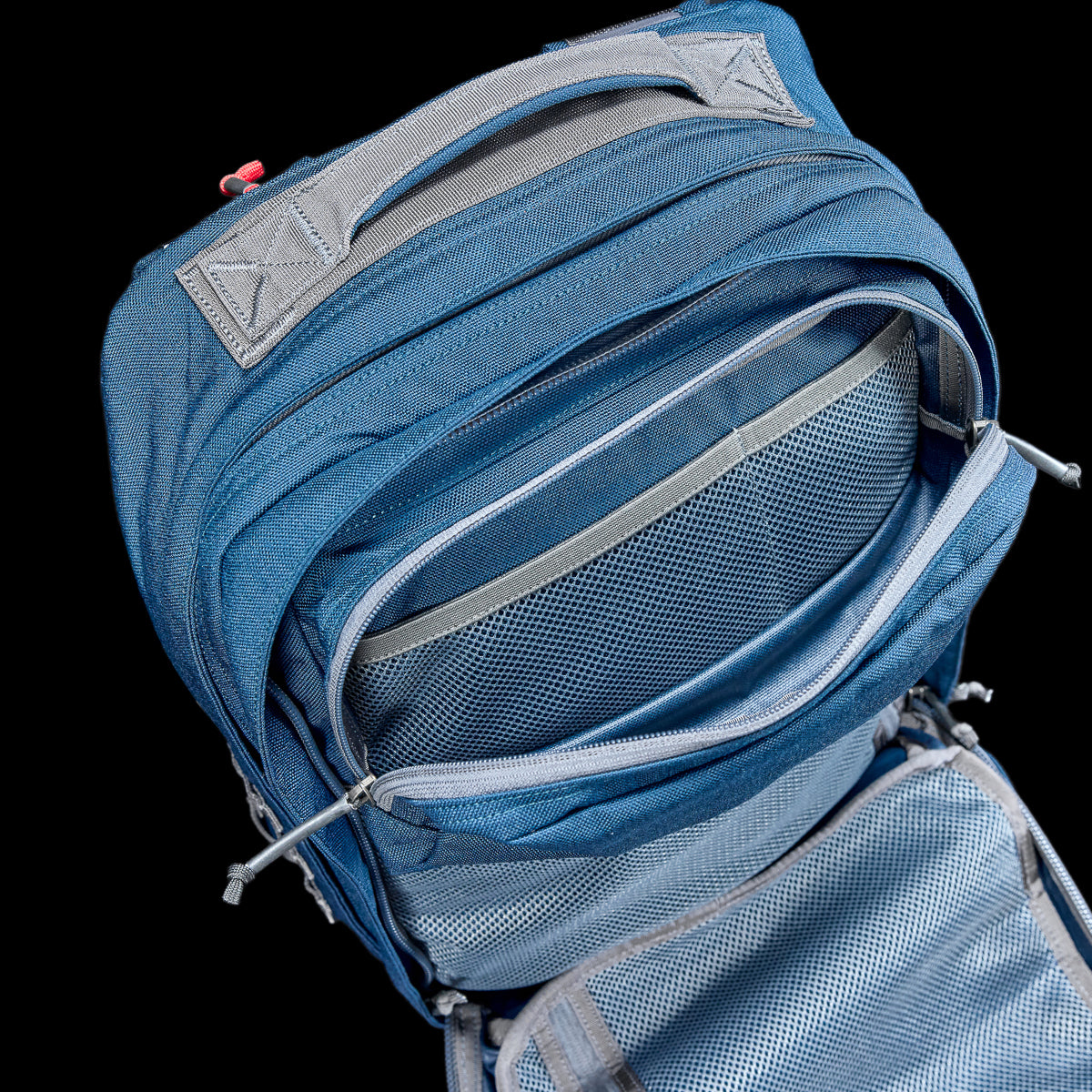 The GR2 - Cordura is a blue and gray backpack featuring multiple open compartments and mesh pockets, crafted to meet the rugged demands of Special Forces.