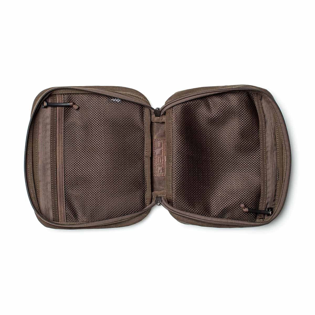 Open brown zippered pouch, similar to the GR2 Field Pocket - Waxed Canvas, displaying two inner mesh compartments.