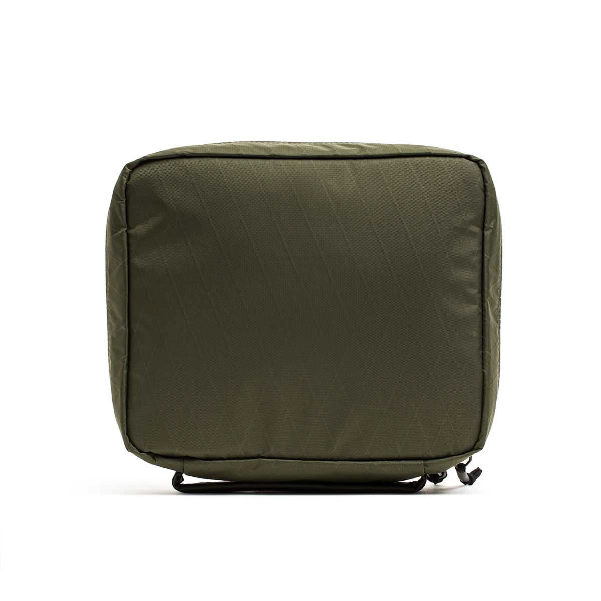The GR2 Field Pocket - X-PAC is an olive green rectangular travel pouch with AquaGuard zippers, waterproof X-PAC fabric, minimal design, and zip closure, displayed against a white background.