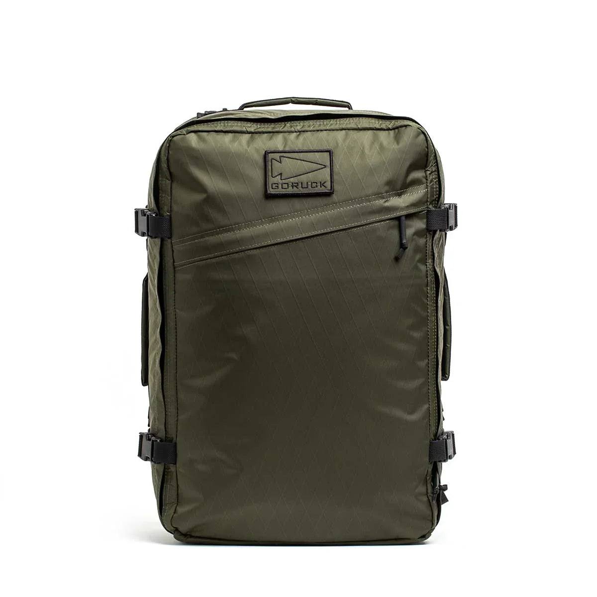 GORUCK dark green durable rucksack with diagonal front zipper and black logo patch on white background