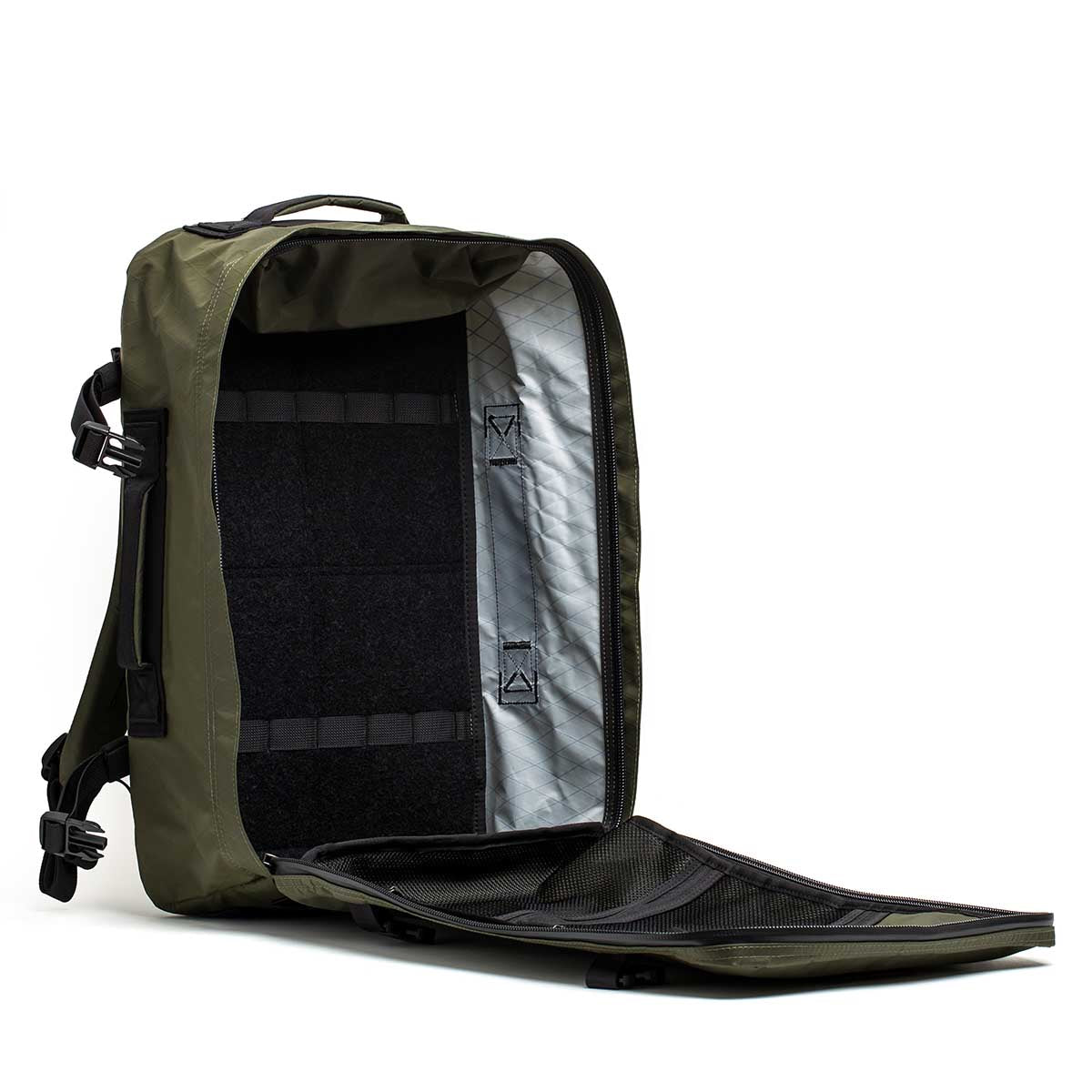 The GR3 - X-PAC carry-on backpack unzips fully to show its spacious interior, mesh pocket on the front flap, and dedicated laptop compartment—ideal as a versatile, waterproof travel bag.