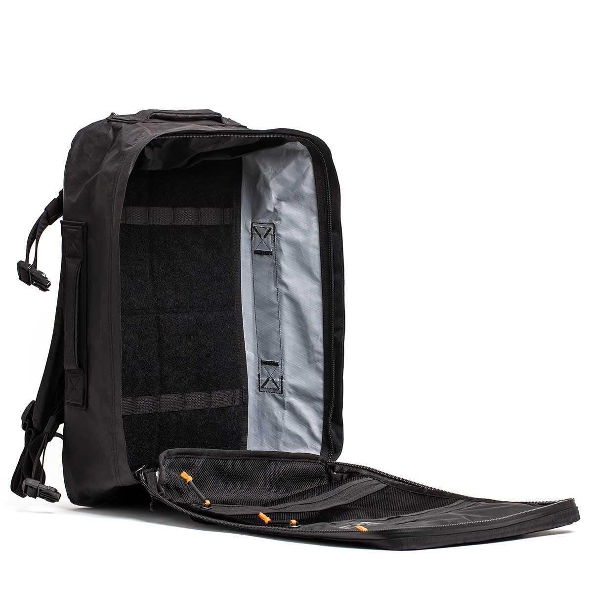 Open black GORUCK backpack showing spacious main compartment and mesh zipper pockets for rugged rucking gear