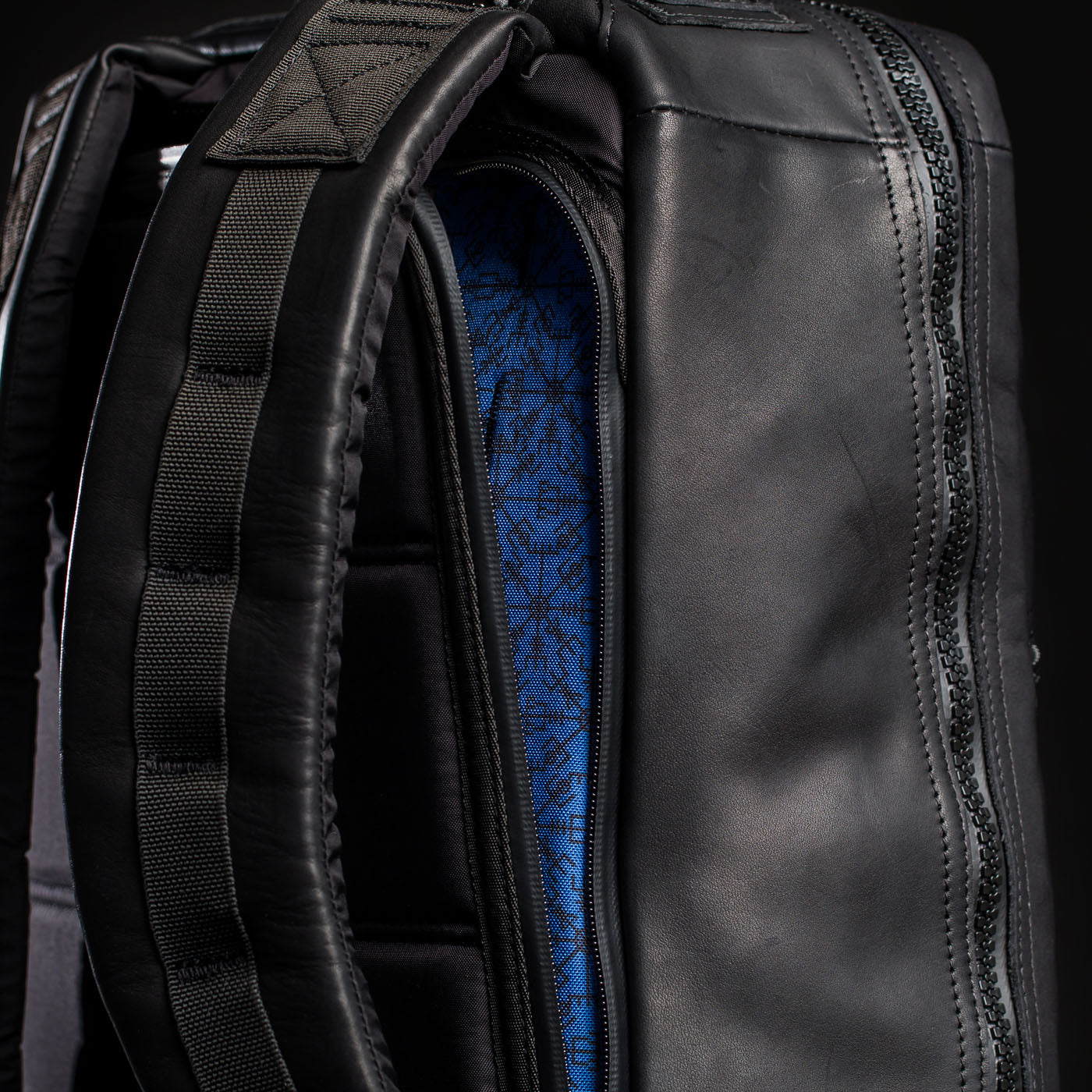 Close-up of the GR1 USA x Carryology - Berserker Viking backpack, showing its blue patterned interior and padded shoulder straps.