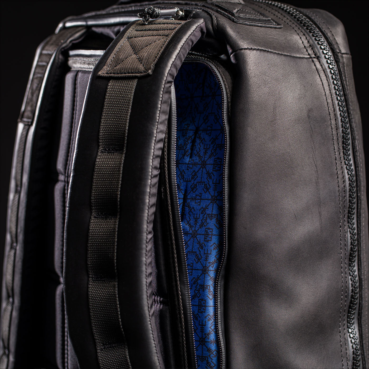 Close-up of the GR1 USA x Carryology - Berserker Viking backpack with padded straps, featuring a blue patterned interior lining inspired by Viking warriors.