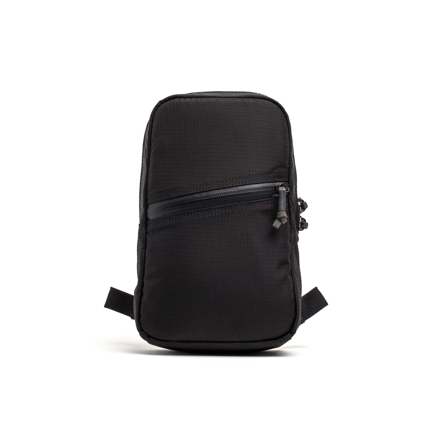 Compact black GORUCK Grenade pack with a diagonal zippered front pocket and durable fabric