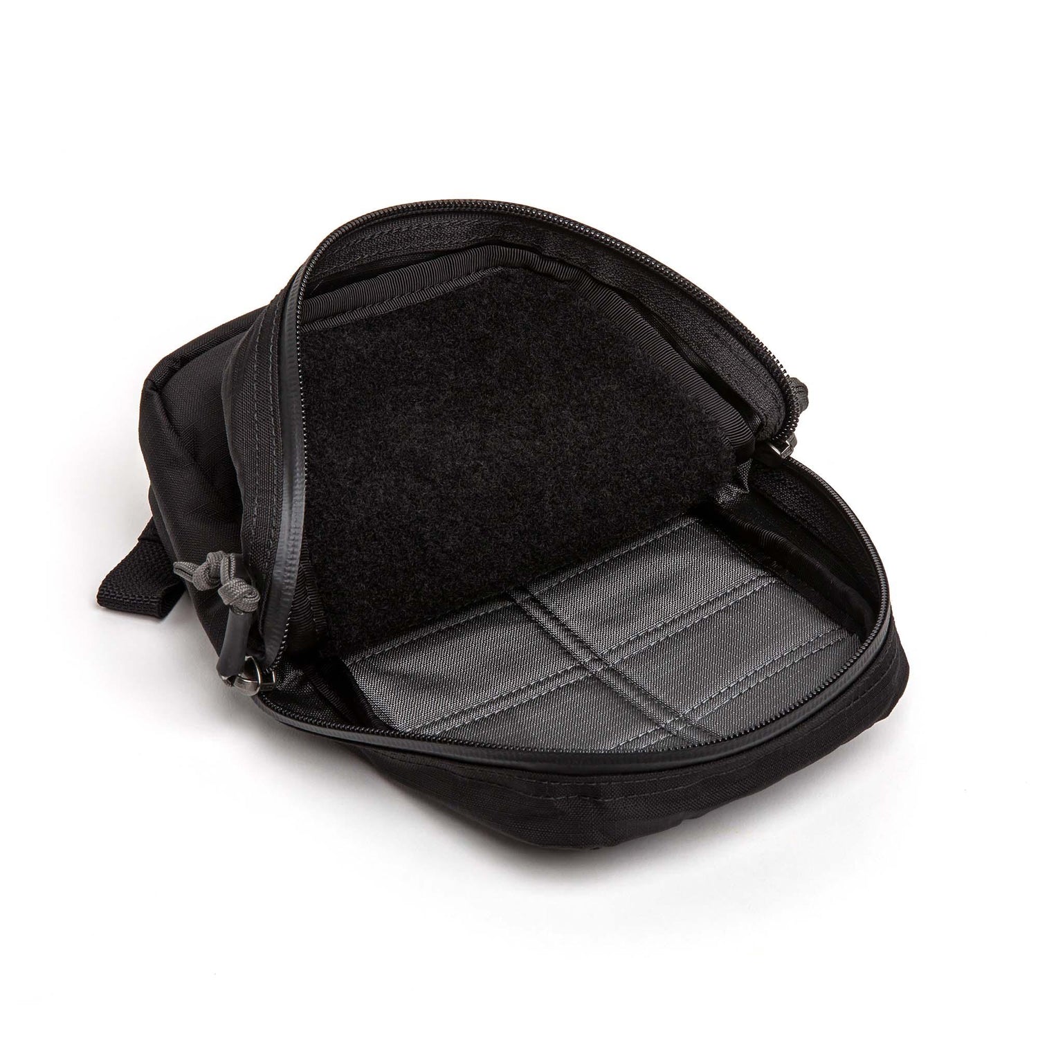 Open black GORUCK Grenade pouch with gray interior and durable zipper on white background