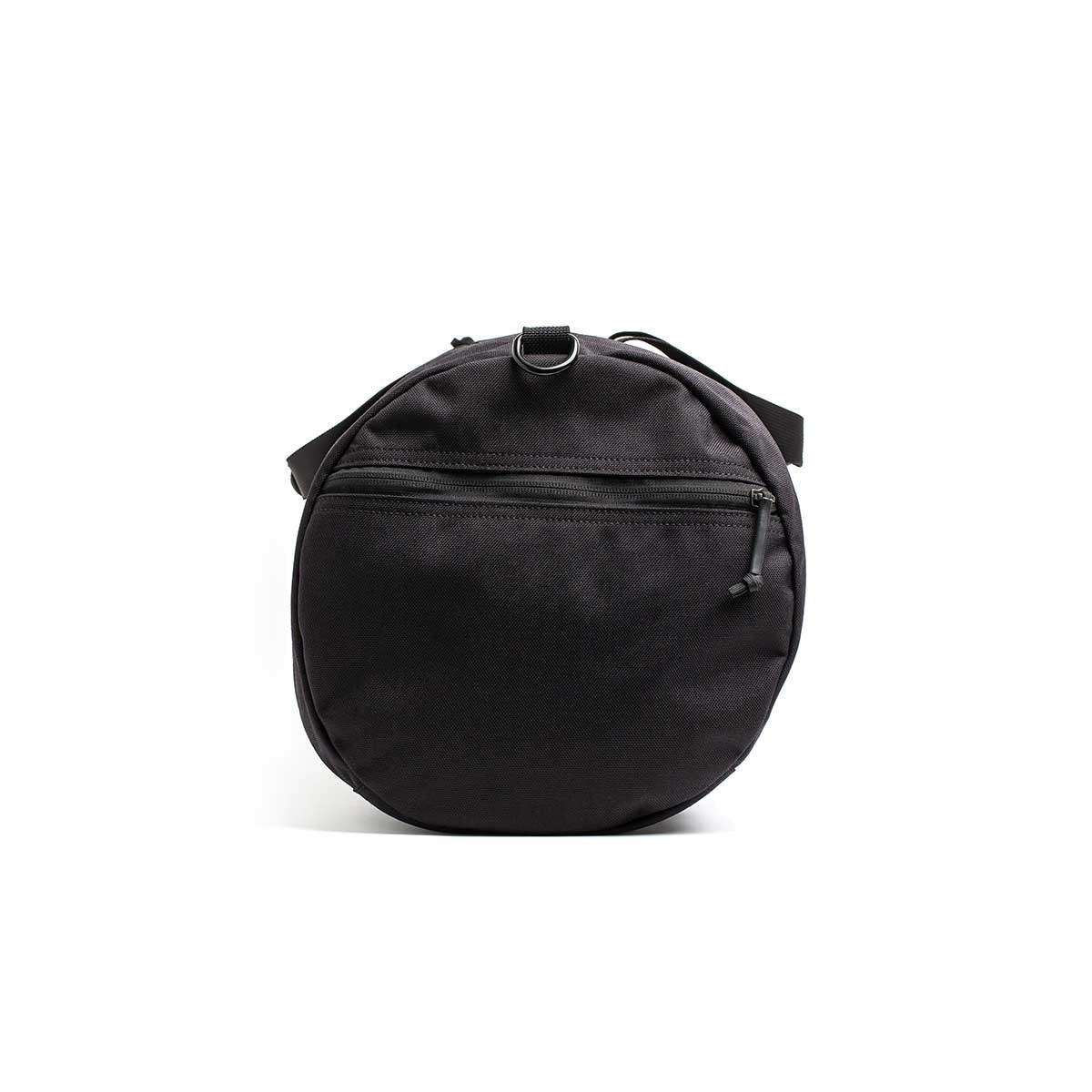 GORUCK black 38L gym bag with zip pocket, durable round design on white background