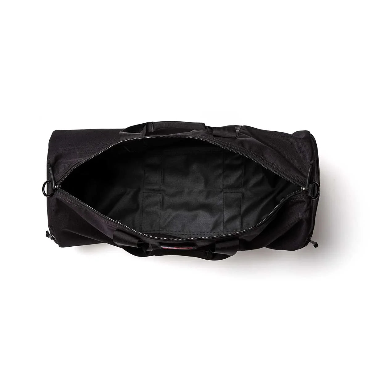 Top view of a black GORUCK 38L gym bag open showing spacious interior and sturdy handles