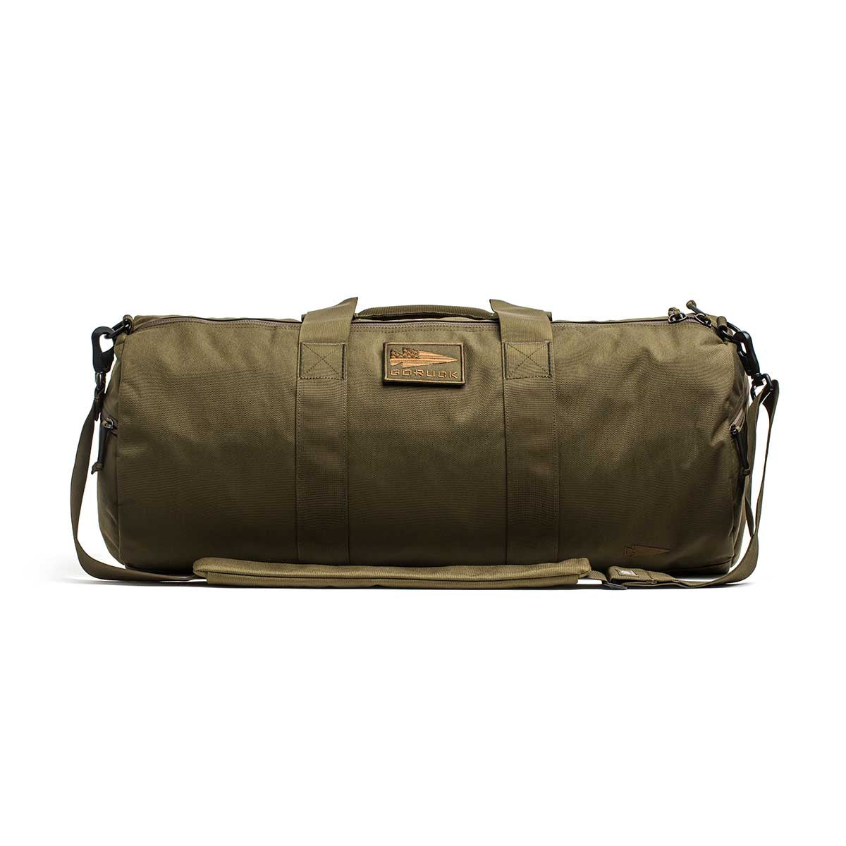 The Gym Bag - Cordura features olive green 1000D CORDURA fabric, sturdy handles, a shoulder strap, and a rectangular front patch.