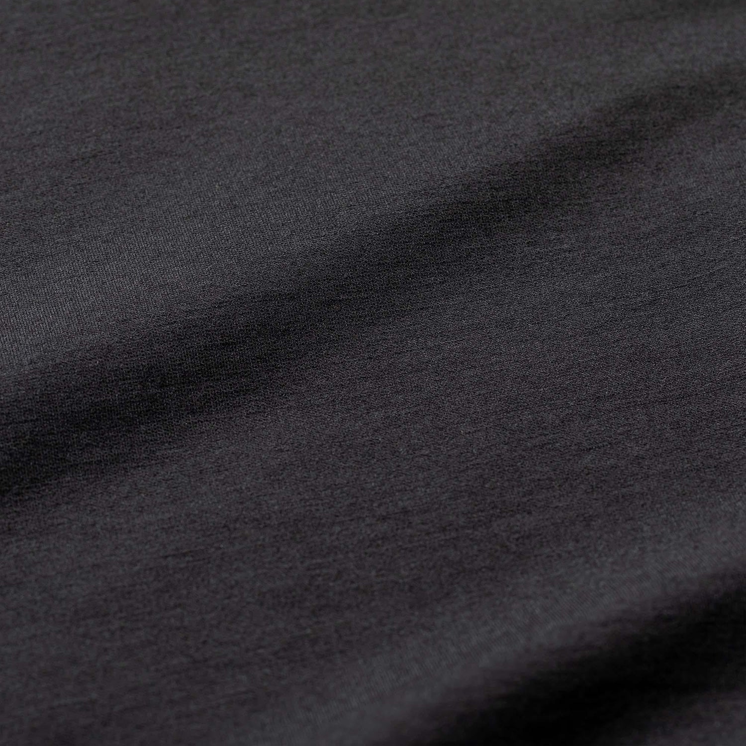 Close-up of black Heavy Merino wool fabric texture from GORUCK rucking gear