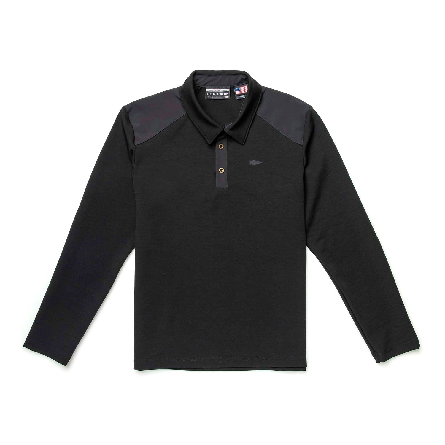 The Heavy Commando Shirt - Merino Wool is a black long-sleeve shirt with a buttoned collar and dark shoulder panels, offering natural moisture wicking, shown laid flat on a white background.