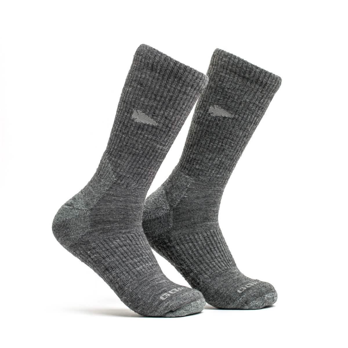 Pair of charcoal long crew merino wool socks with ribbed texture and reinforced toe