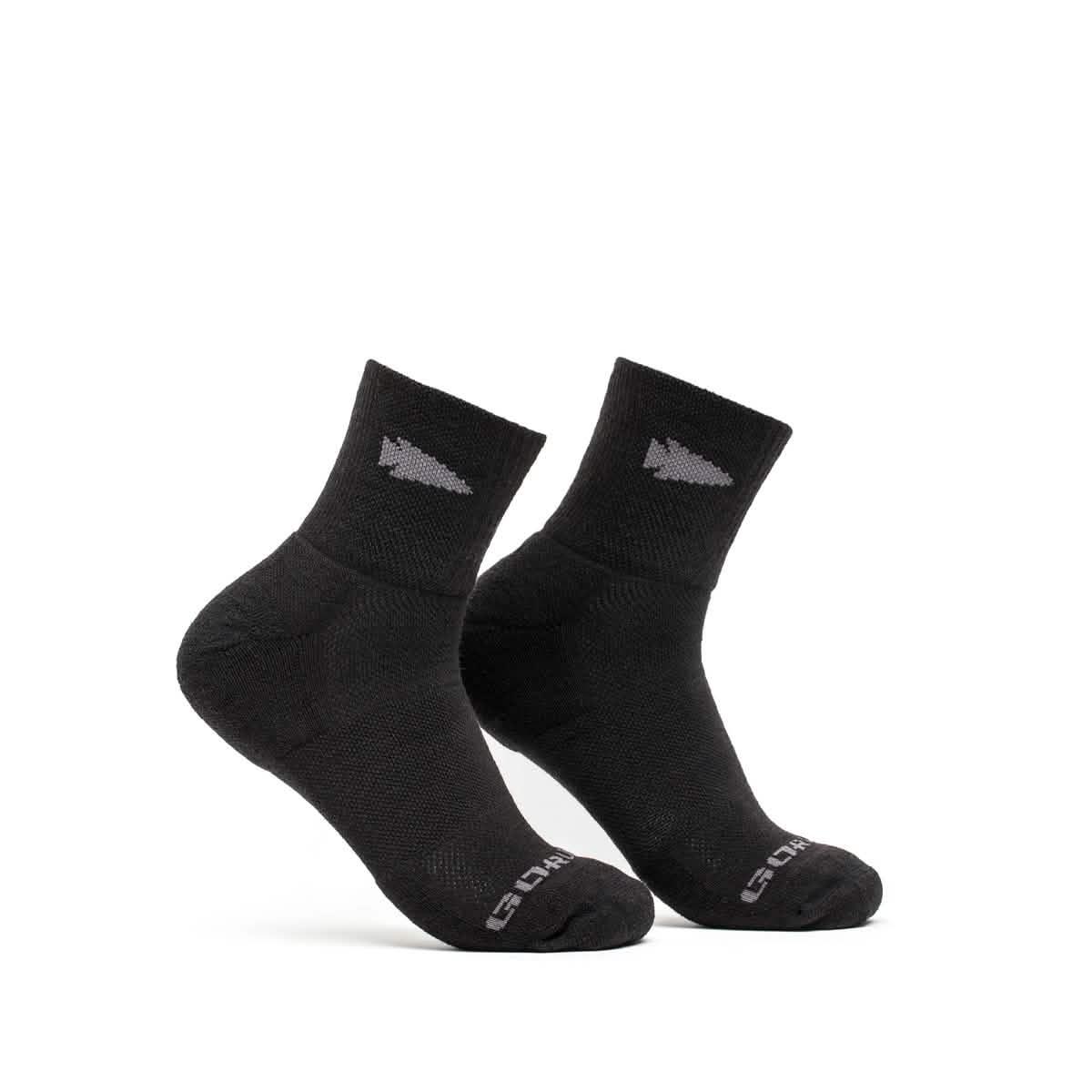 Pair of black GORUCK merino wool trail cuff socks with logo on cuff and toe