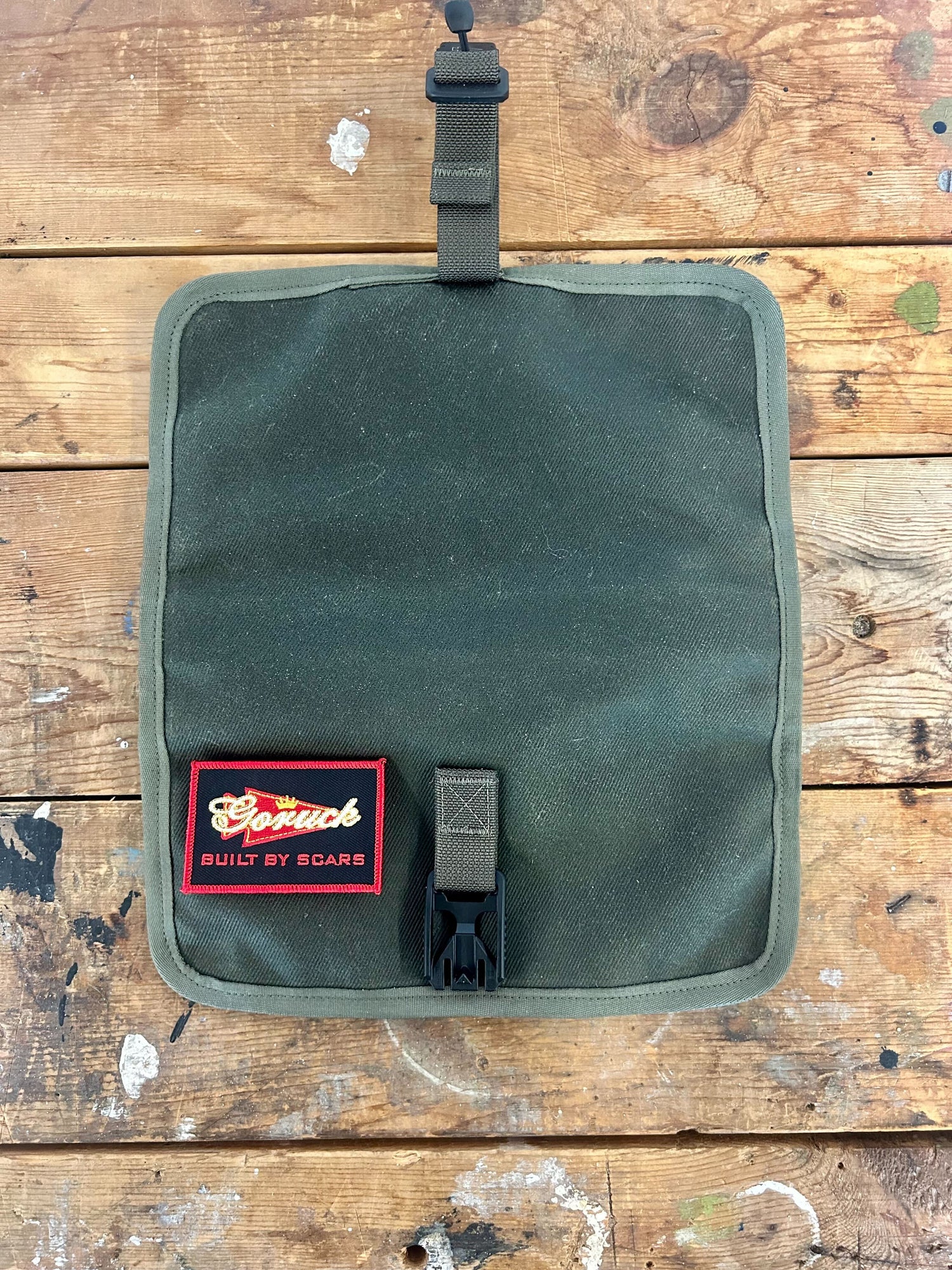 A green Scars Wire Dopp with a red