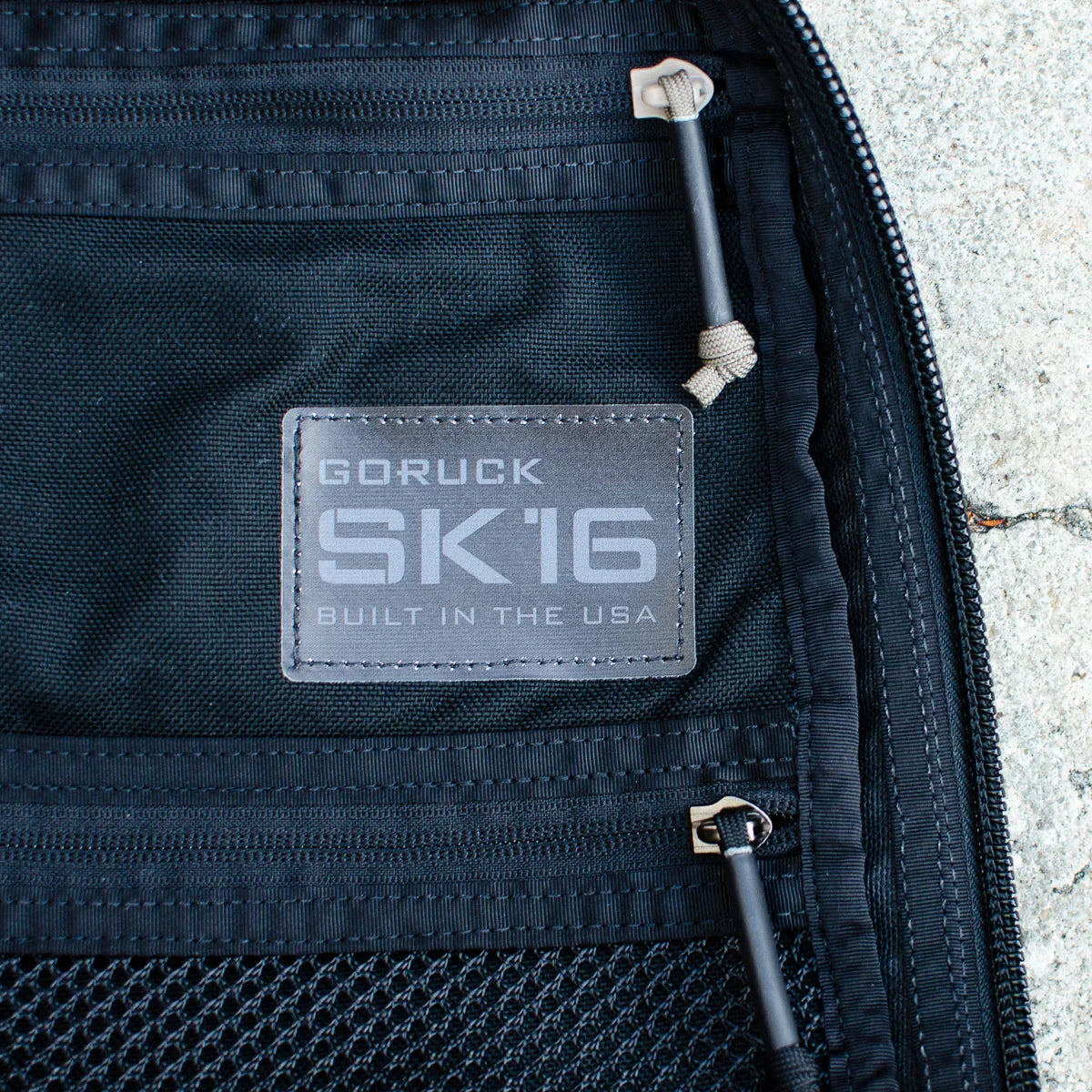 GORUCK SK16 rucksack interior label detail, durable black fabric with USA made patch and zippers