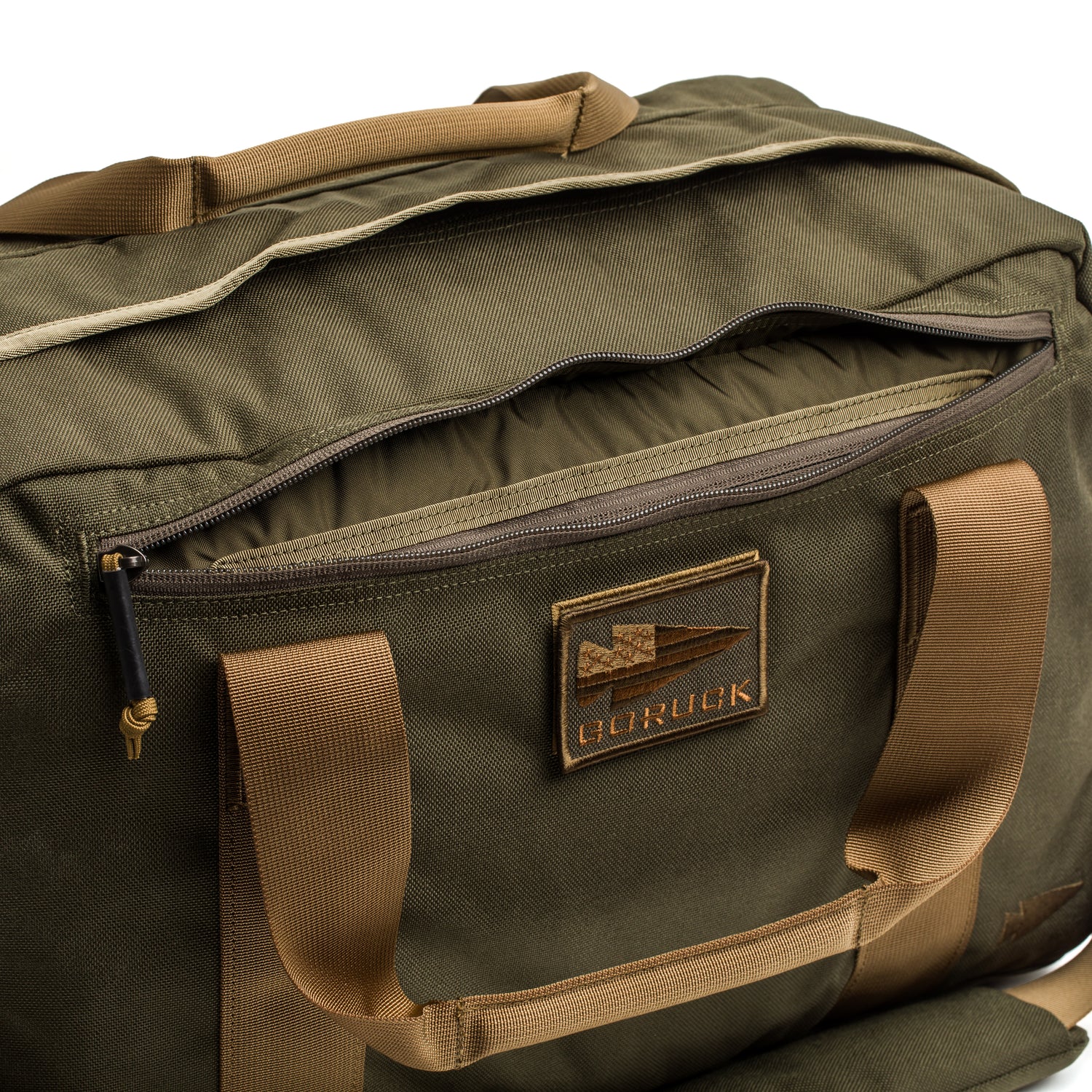 Olive green Kit Bag (Includes Shoulder Strap) with tan handles, partially unzipped to reveal the top compartment—reflecting the rugged style of a Special Forces flight bag.