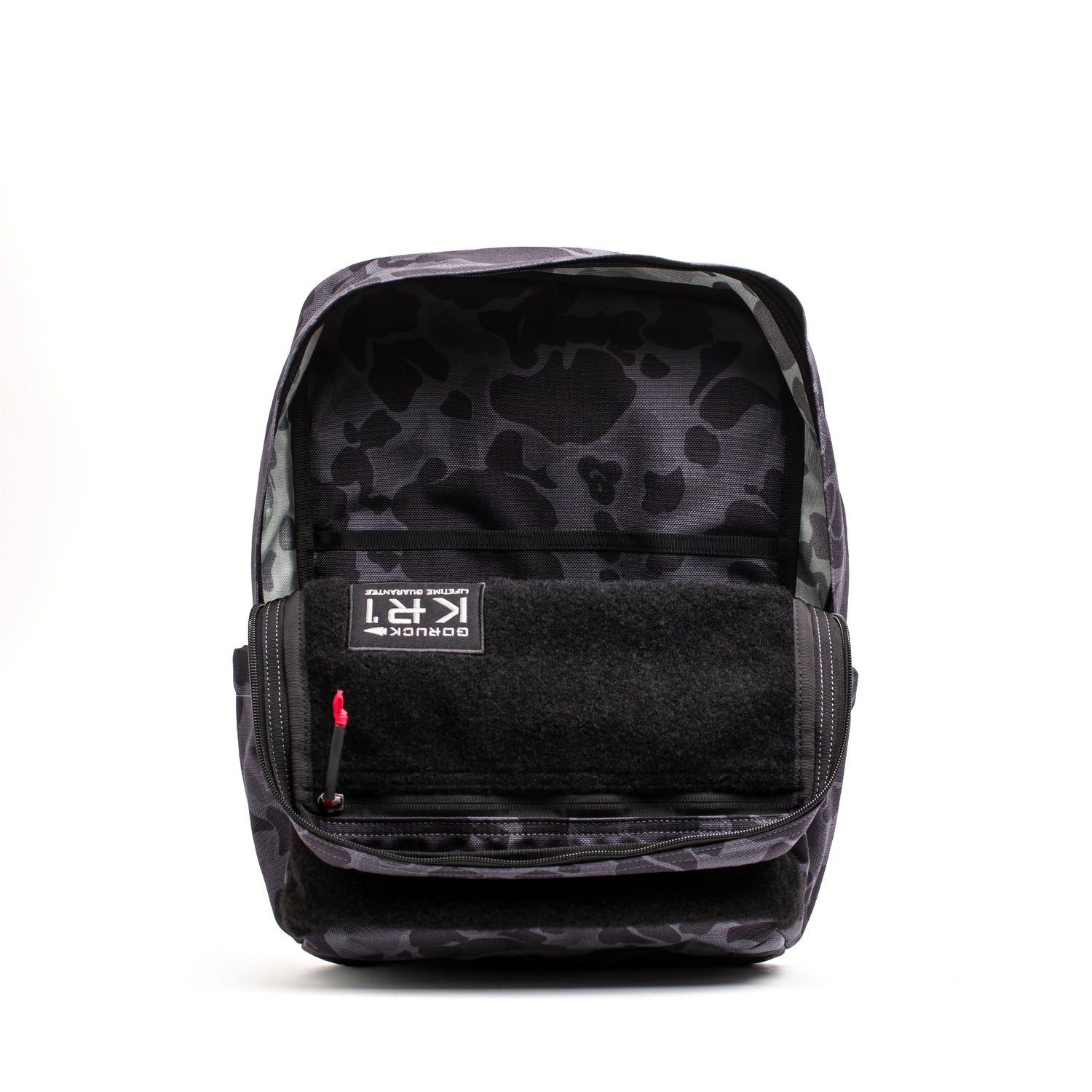Open GORUCK backpack in black frogskin camouflage showing interior compartments and durable design
