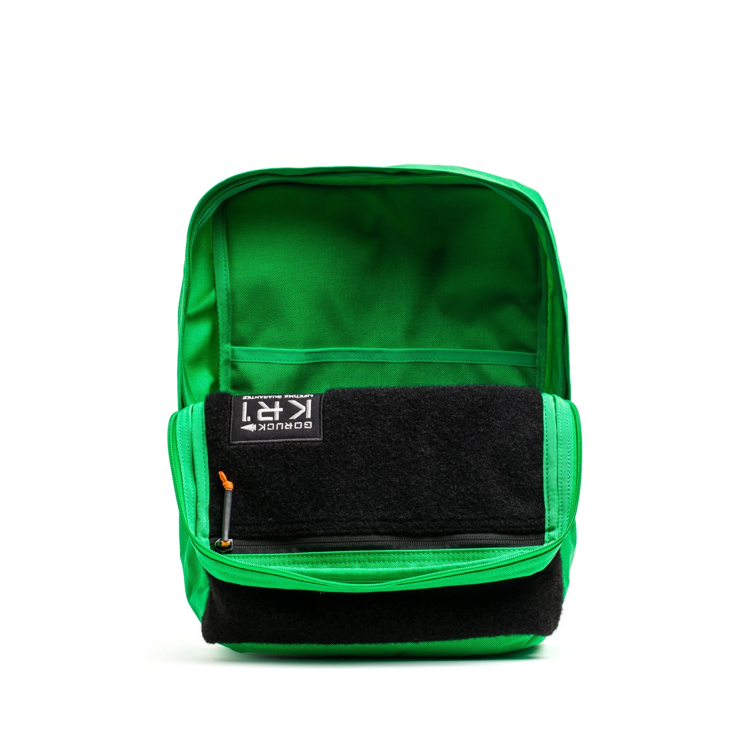 Open bright green GORUCK rucksack with black front panel and zipper pocket, showing interior storage