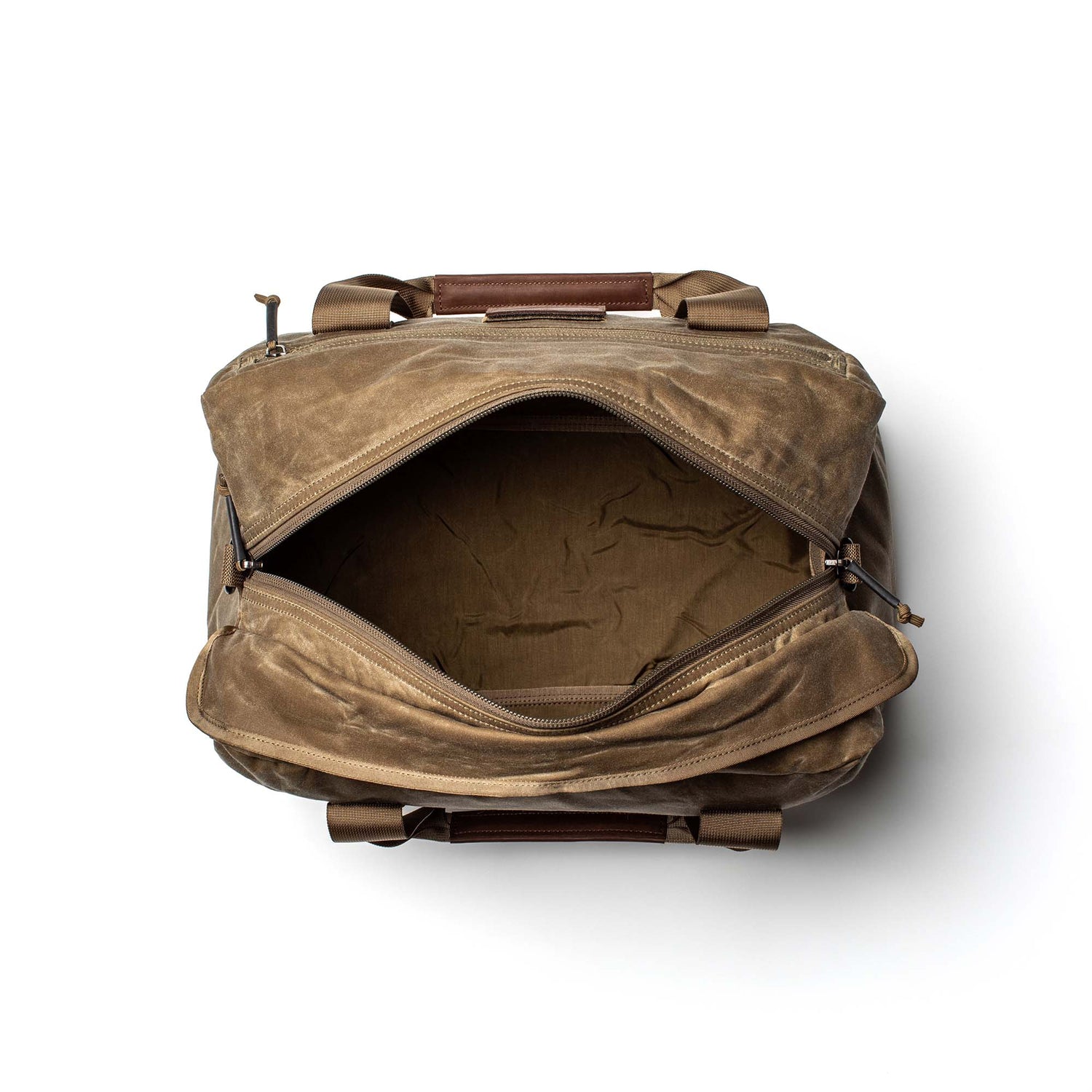 Top view of an open Kit Bag - Waxed Canvas in tan with brown handles on a white background, reminiscent of a classic pilot flight bag.