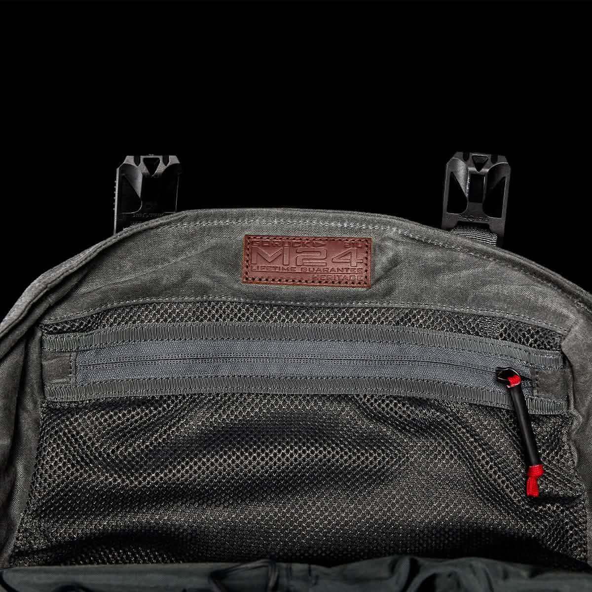 GORUCK M24 Slate backpack interior with mesh zip pocket and brown leather patch