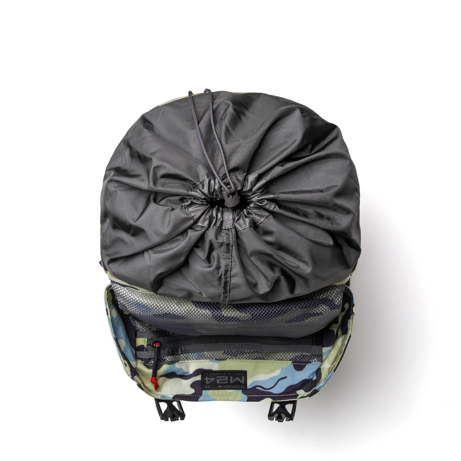 GORUCK backpack top view showing Everglades camo pattern with black drawstring closure pouch and mesh compartment