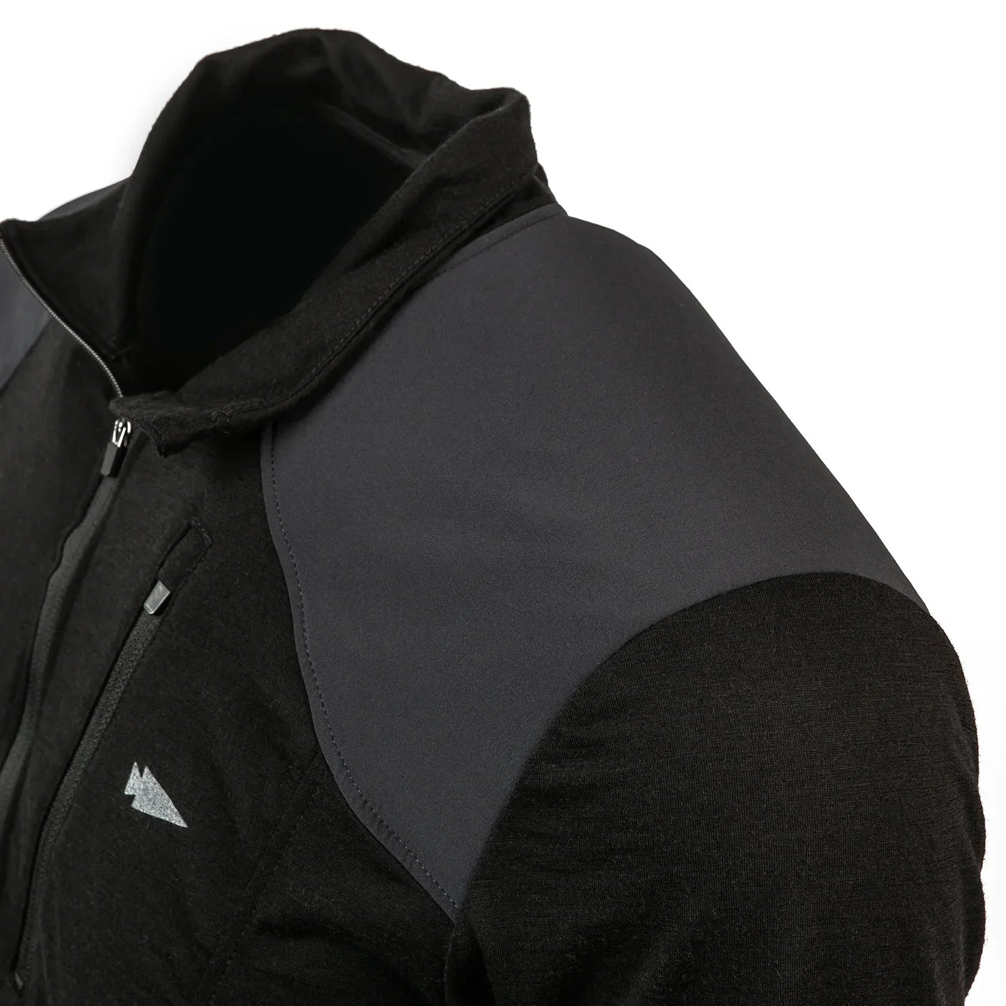 Close-up of the Men’s Commando Half Zip - Merino Wool, a black jacket featuring dark gray reinforced shoulder panels and a small triangular logo on the chest.