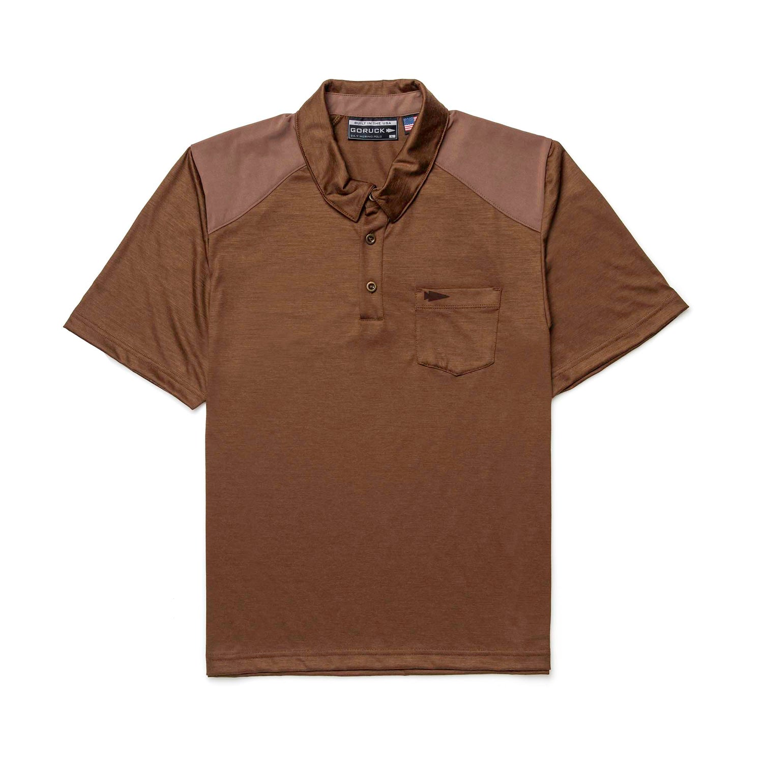 The Men's Commando Polo - Merino Wool is a brown short-sleeve shirt with a chest pocket and darker shoulder panels. Laid flat, this antimicrobial polo combines comfort and style for any occasion.