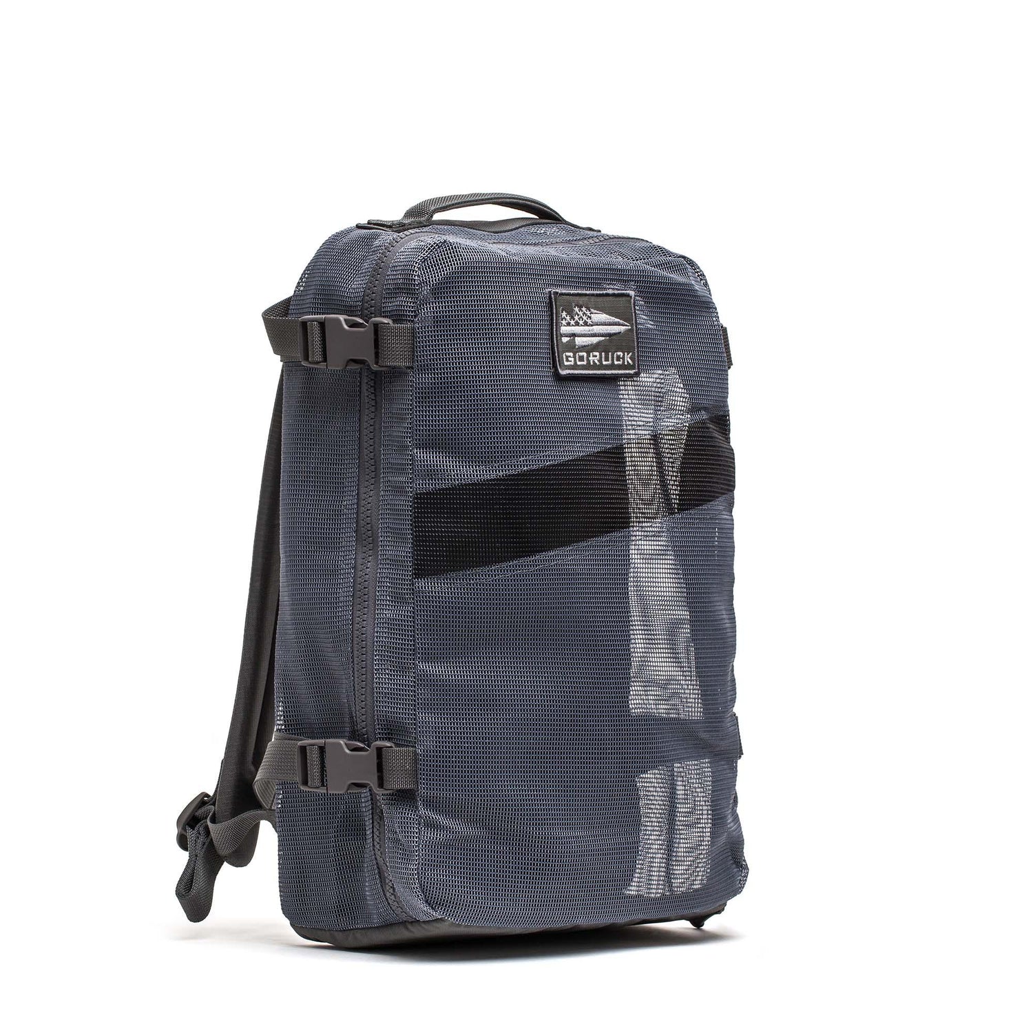 A gray Mesh Ruck backpack by GORUCK, quick-drying with side straps and a top handle, is shown upright on a white background.